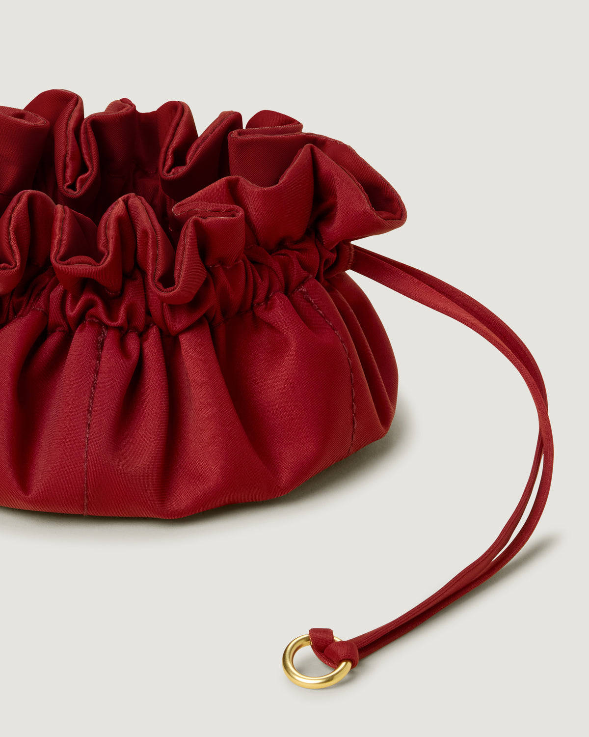 Close-up of handwoven detailing on Lotus Jewelry Pouch in Rosso.