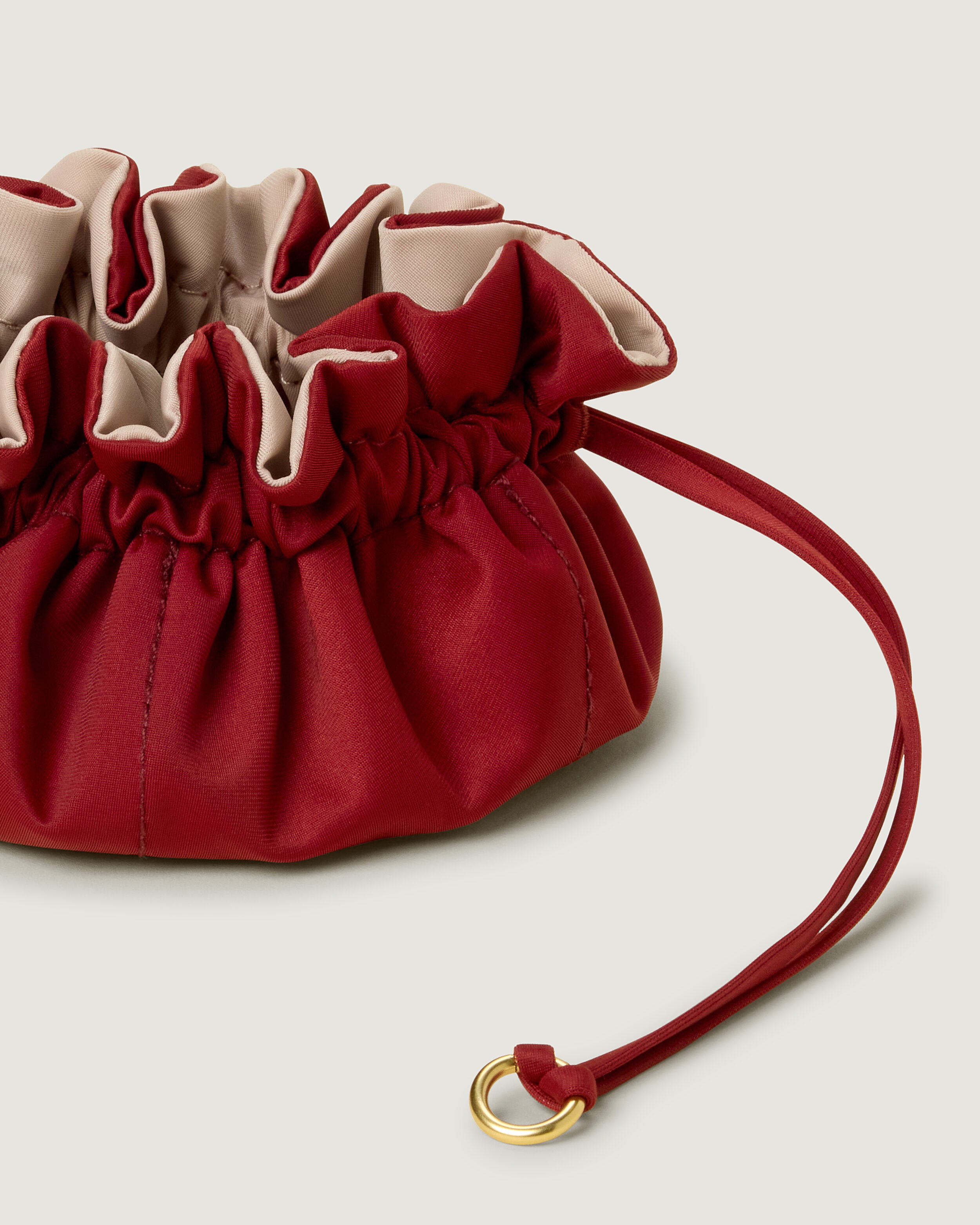 Close-up of handwoven detailing on Lotus Jewelry Pouch in Rosso.