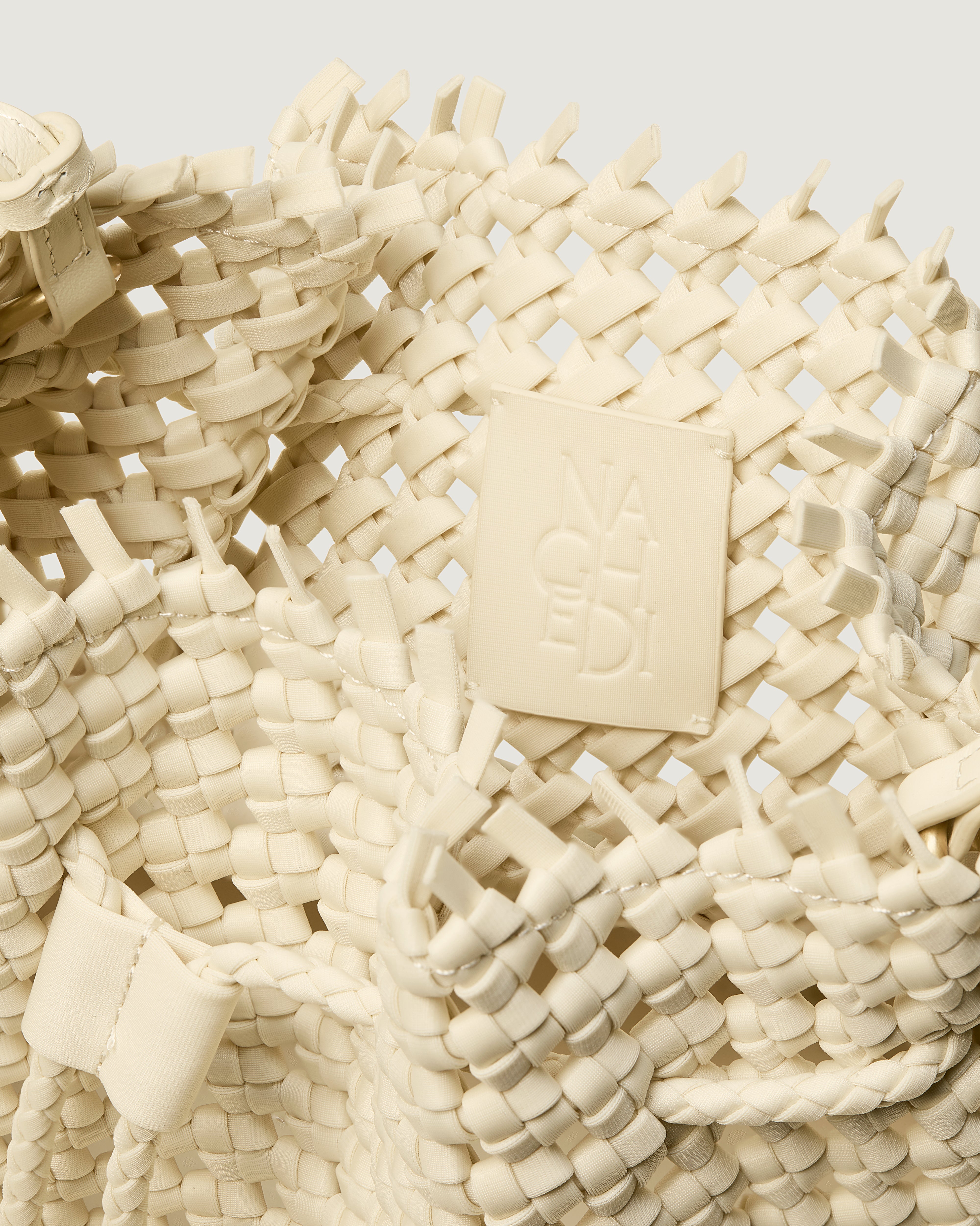 Interior close-up of Mallorca Bucket in Salt showing its drawstring closure, and unlined interior.