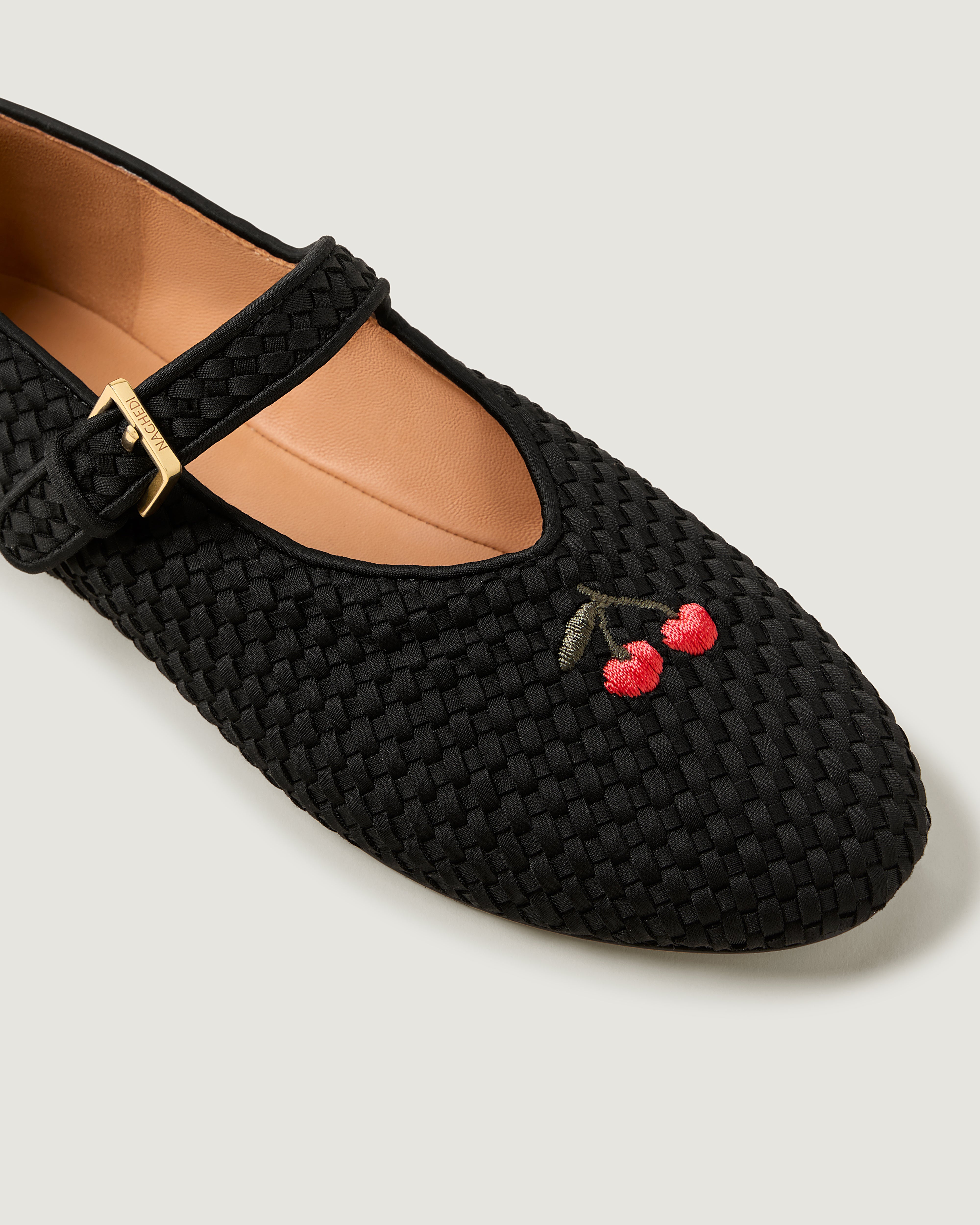 Close-up of The Marais Mary Jane in Onyx showing its closed toe, round silhouette, and cherry embroidery.