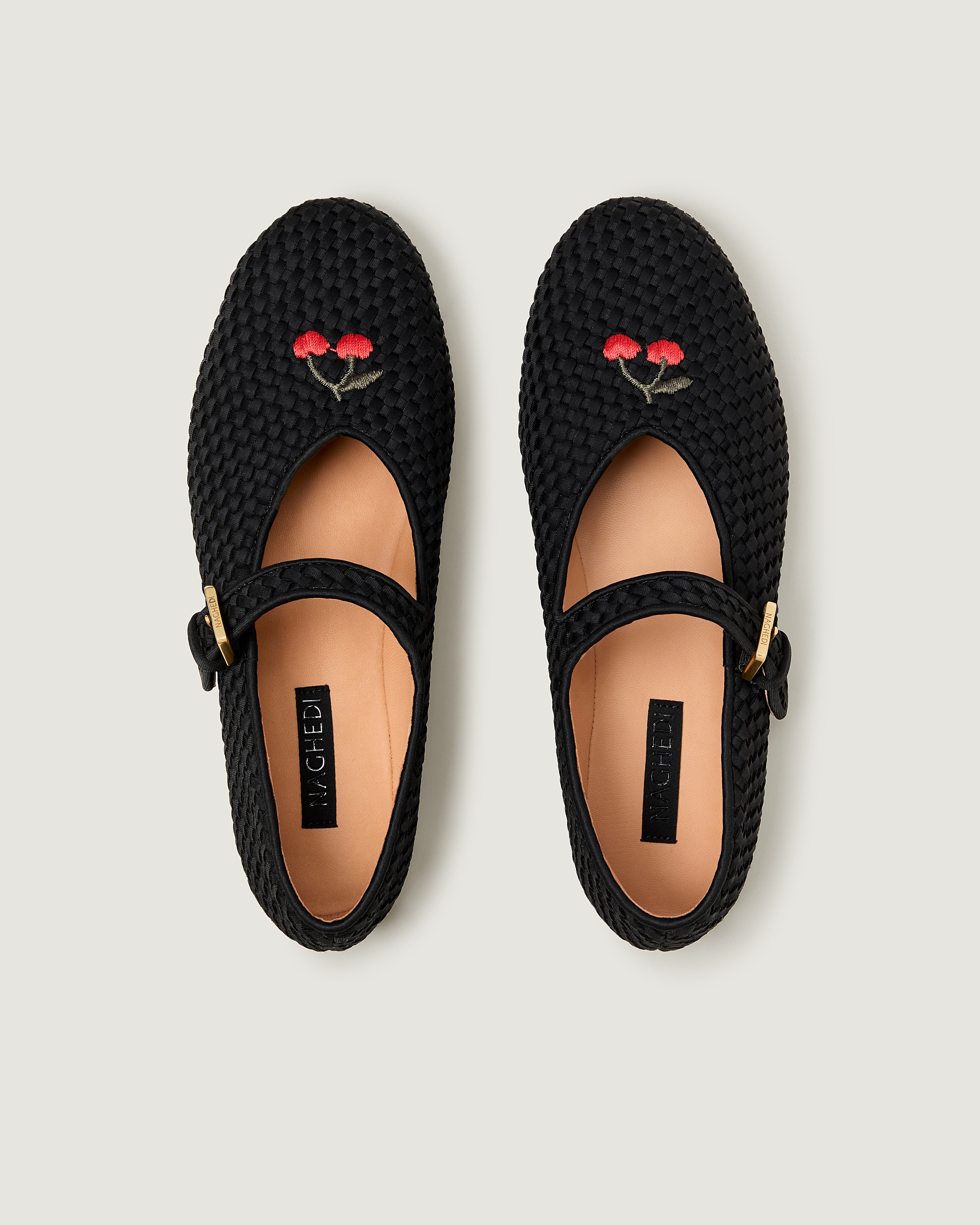 Top view of pair of The Marais Mary Jane in Onyx showing the natural tanned leather insole.