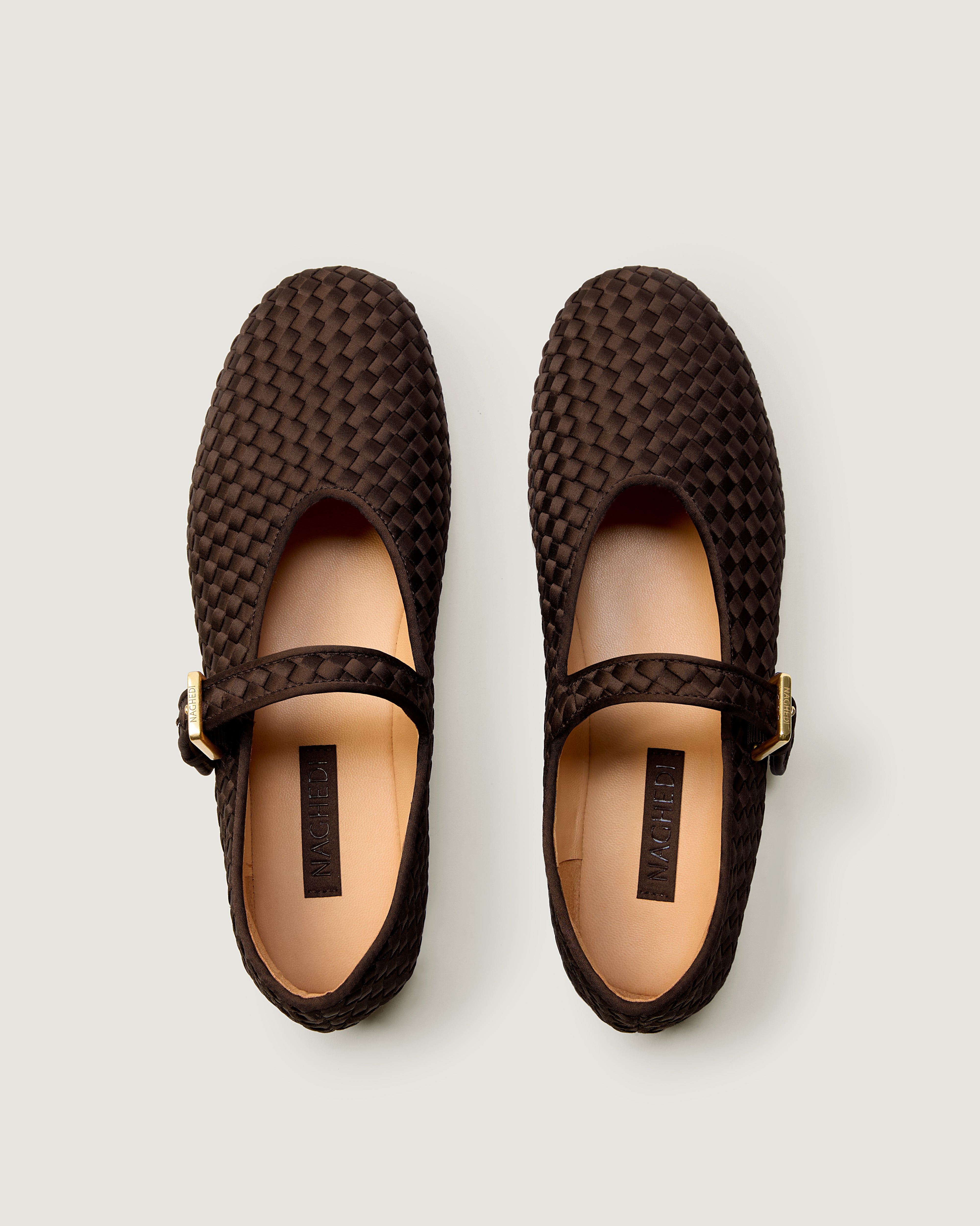 Top view of pair of The Marais Mary Jane in Chocolate showing the natural tanned leather insole.