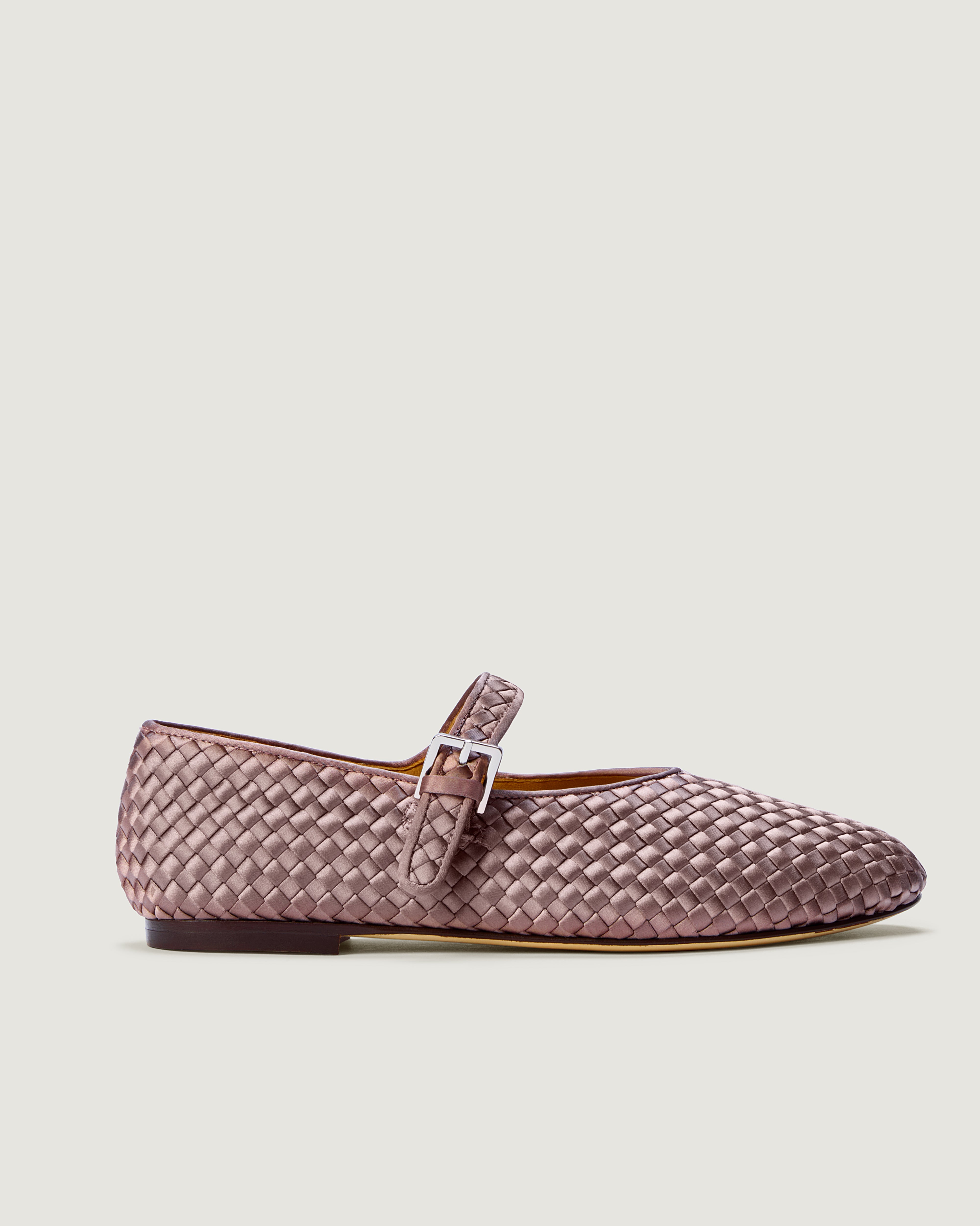 Side view of The Marais Mary Jane in Lavender, a light purple tone, featuring a closed toe and round silhouette, featuring an adjustable strap with buckle closure.