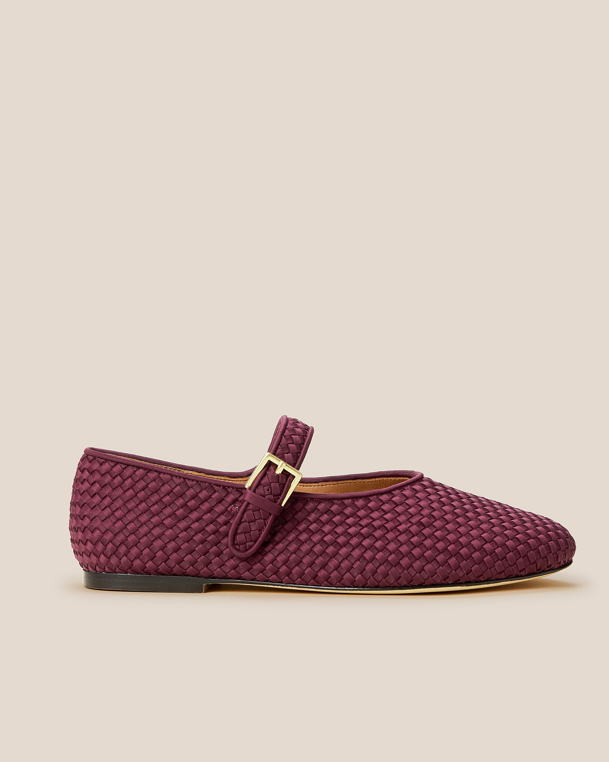 Side view of Marais Mary Jane Flats in Bordeaux, a rich burgundy tone, featuring a closed toe and round silhouette, featuring an adjustable strap with buckle closure.