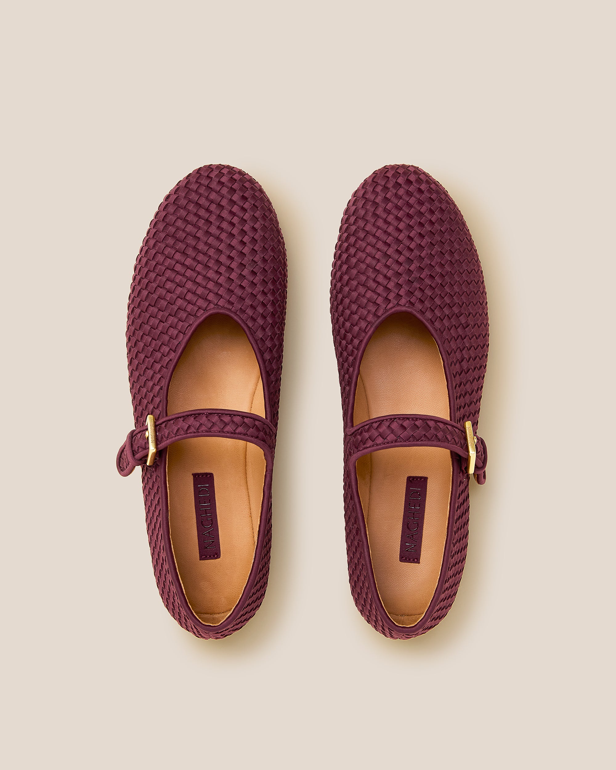 Top view of pair of Marais Mary Jane Flats in Bordeaux showing the natural tanned leather insole.