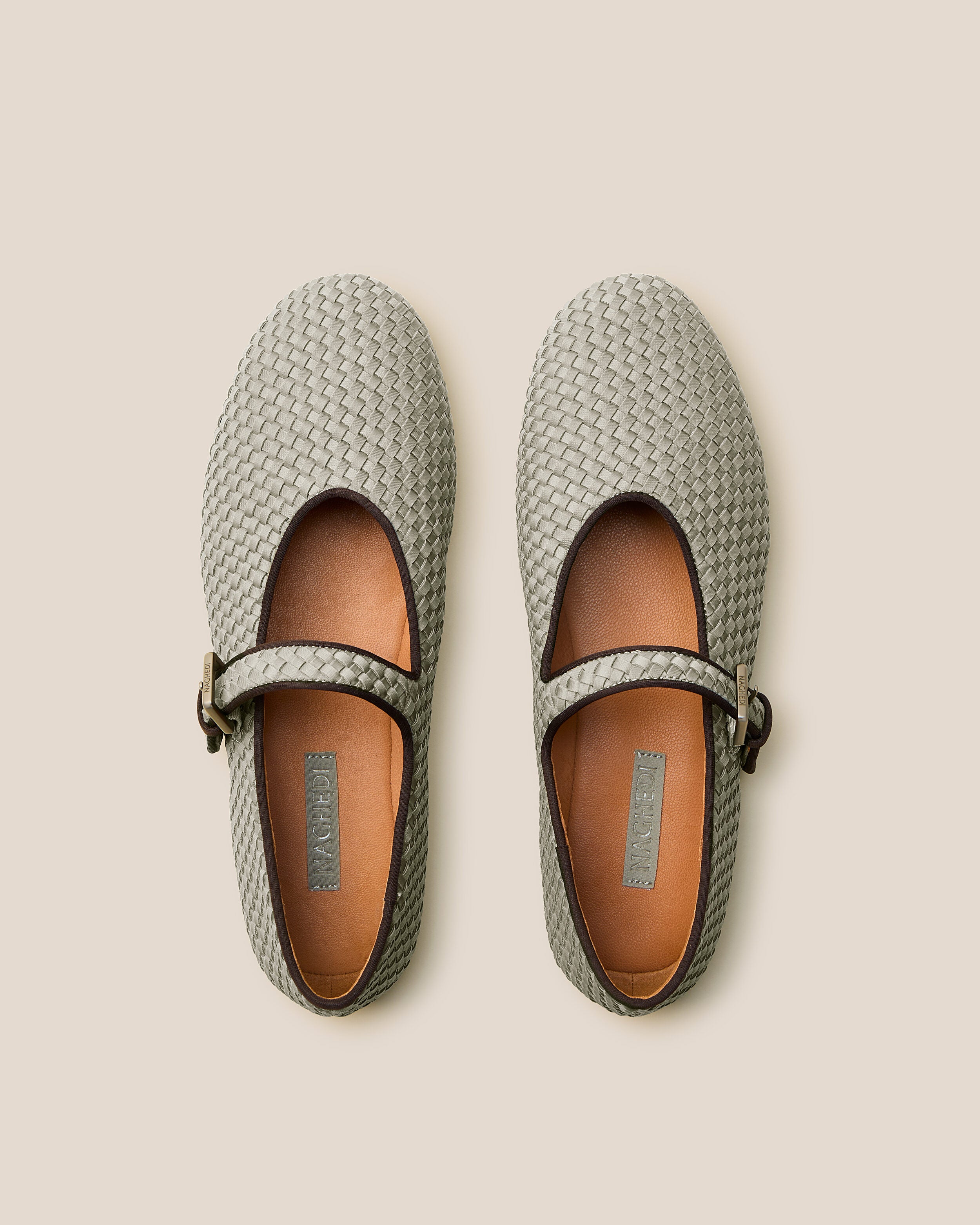 Top view of pair of The Marais Mary Jane in Celadon showing the natural tanned leather insole.