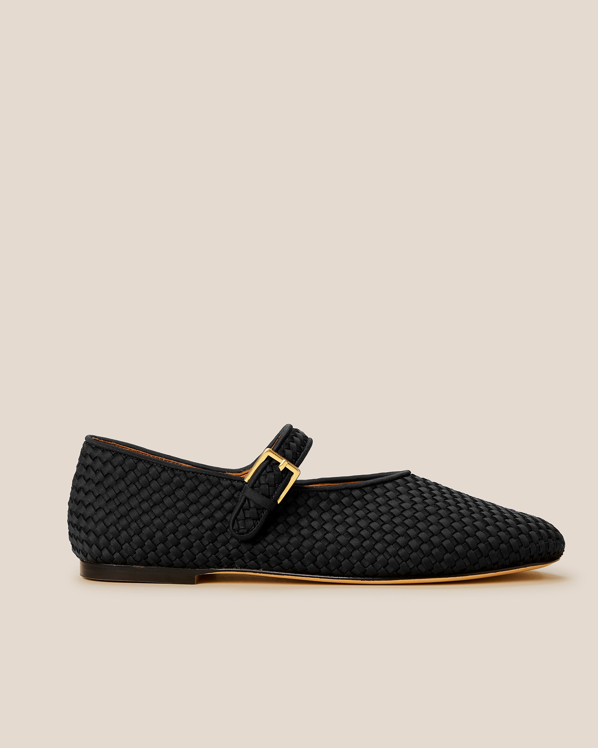 Side view of Marais Mary Jane Flats in Onyx, a true black tone, featuring a closed toe and round silhouette, featuring an adjustable strap with buckle closure.