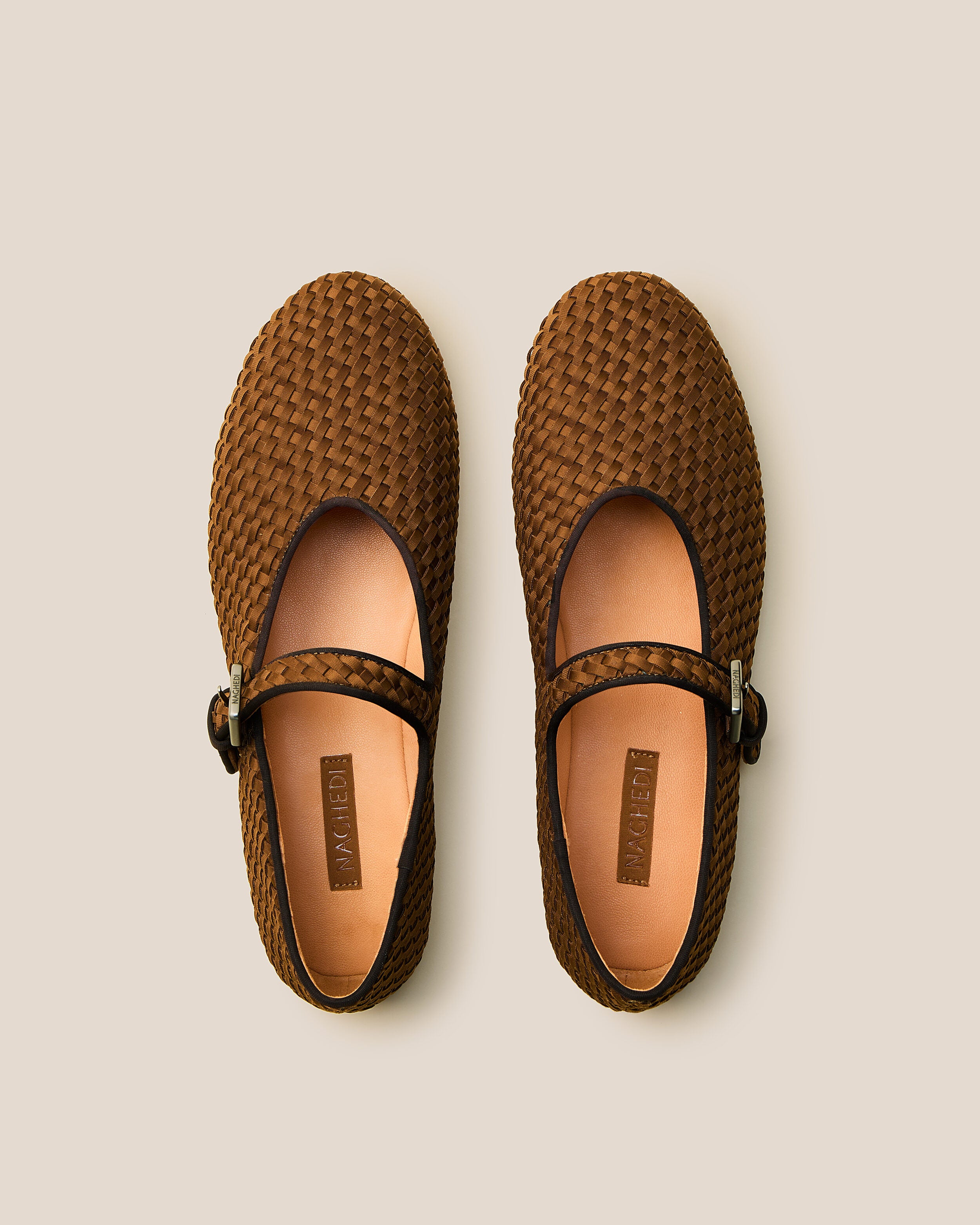 Top view of pair of The Marais Mary Jane in Teak showing the natural tanned leather insole.
