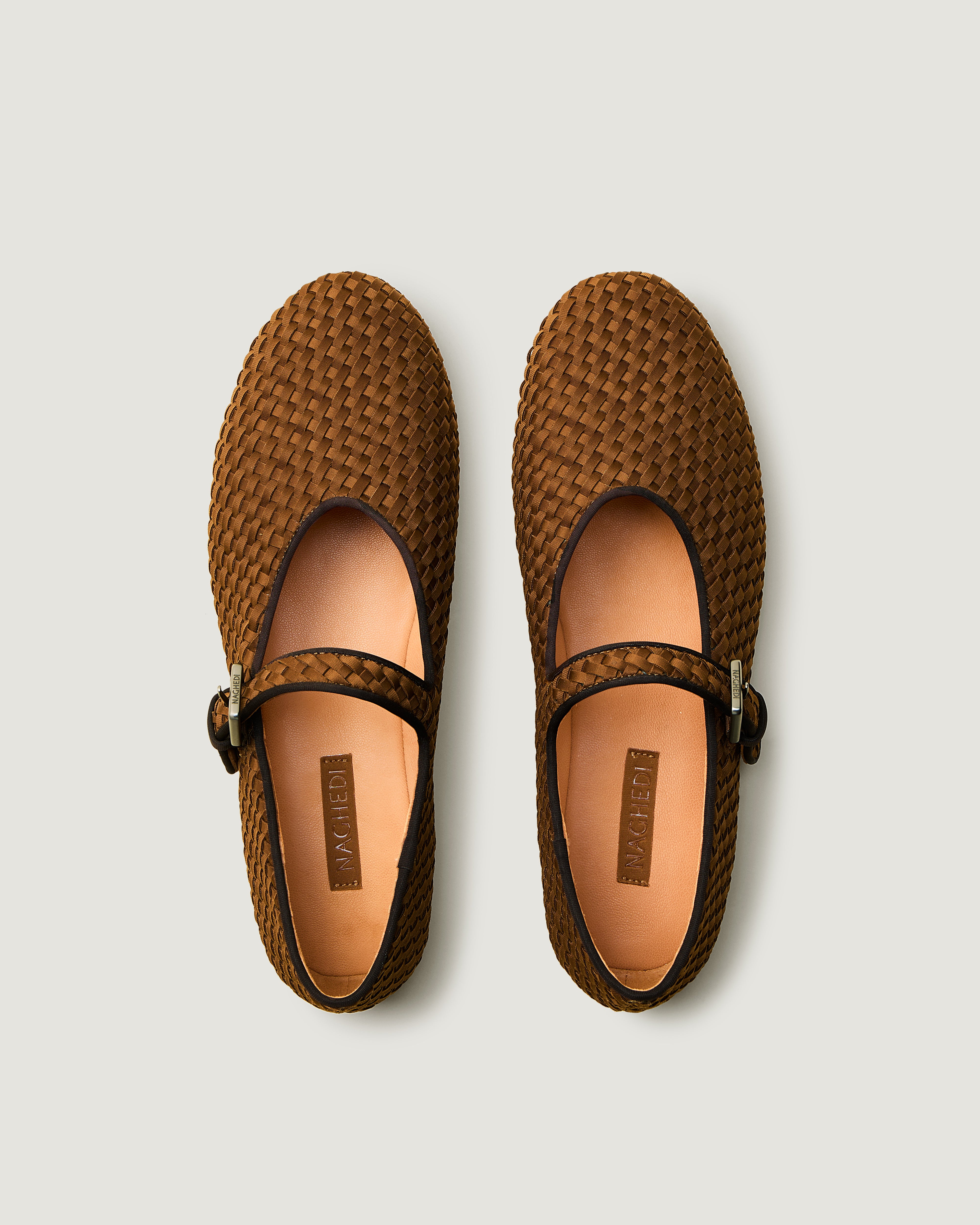 Top view of pair of The Marais Mary Jane in Teak showing the natural tanned leather insole.