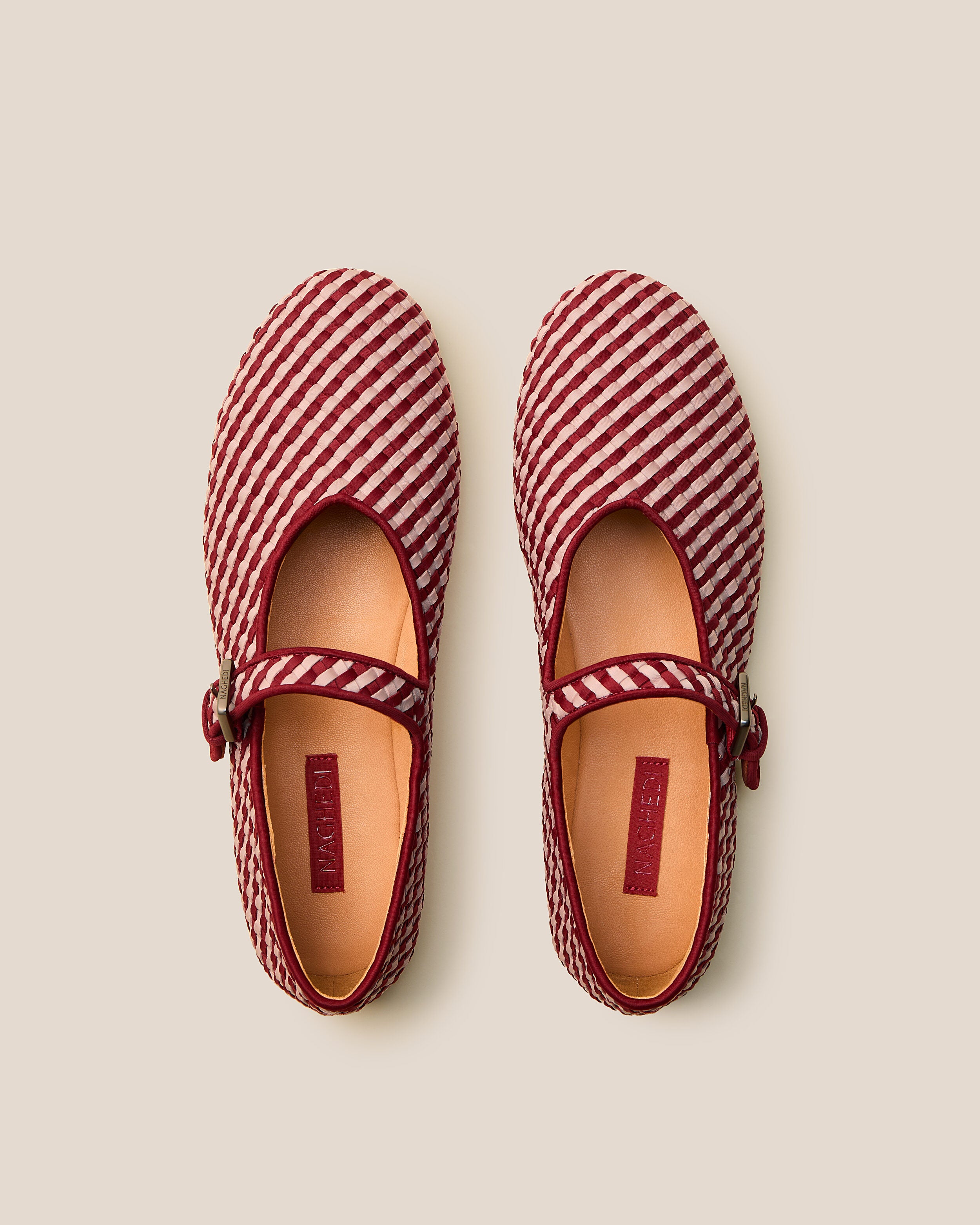 Top view of pair of The Marais Mary Jane in Lychee showing the natural tanned leather insole.