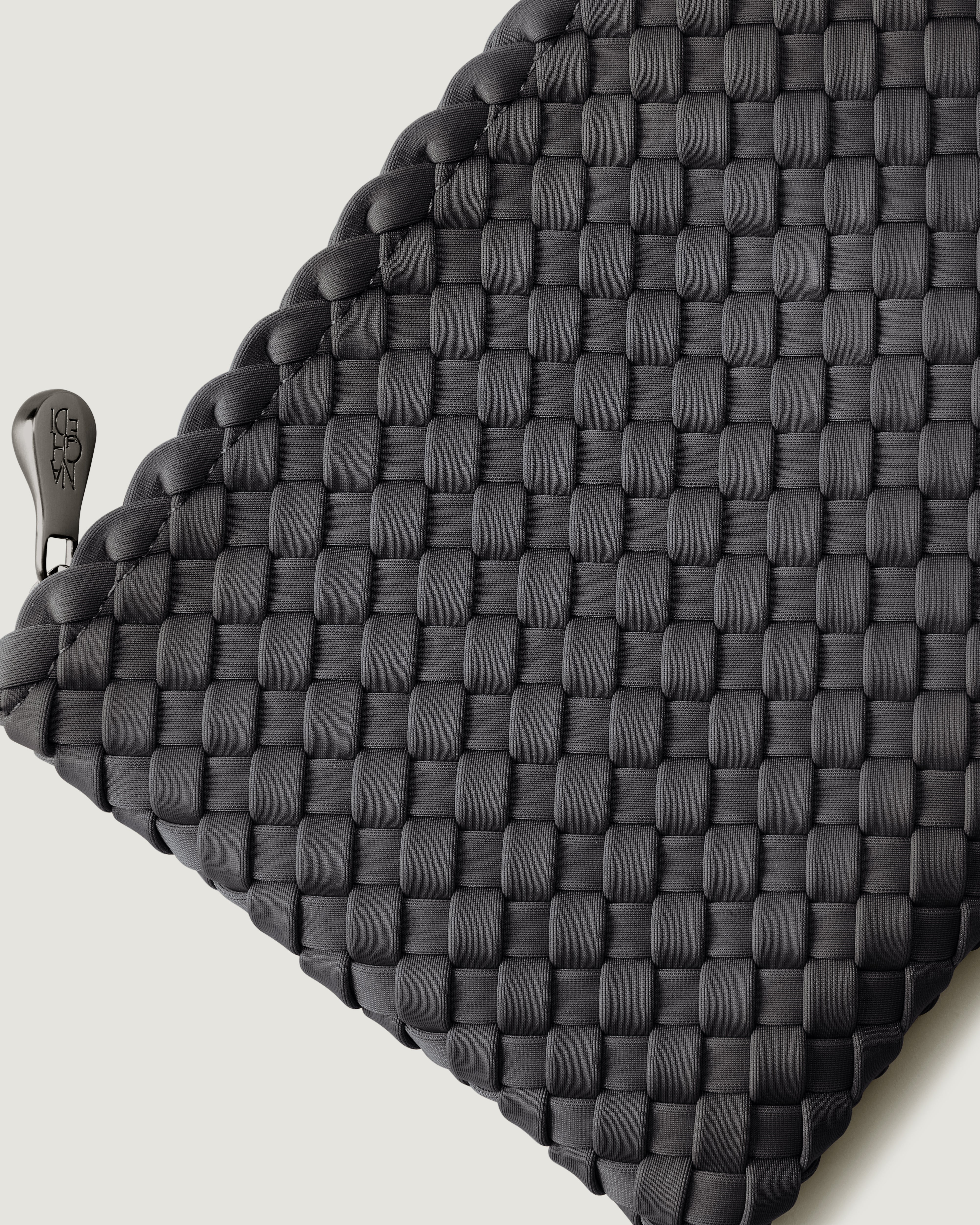 Close-up of included matching woven zippered pouch.