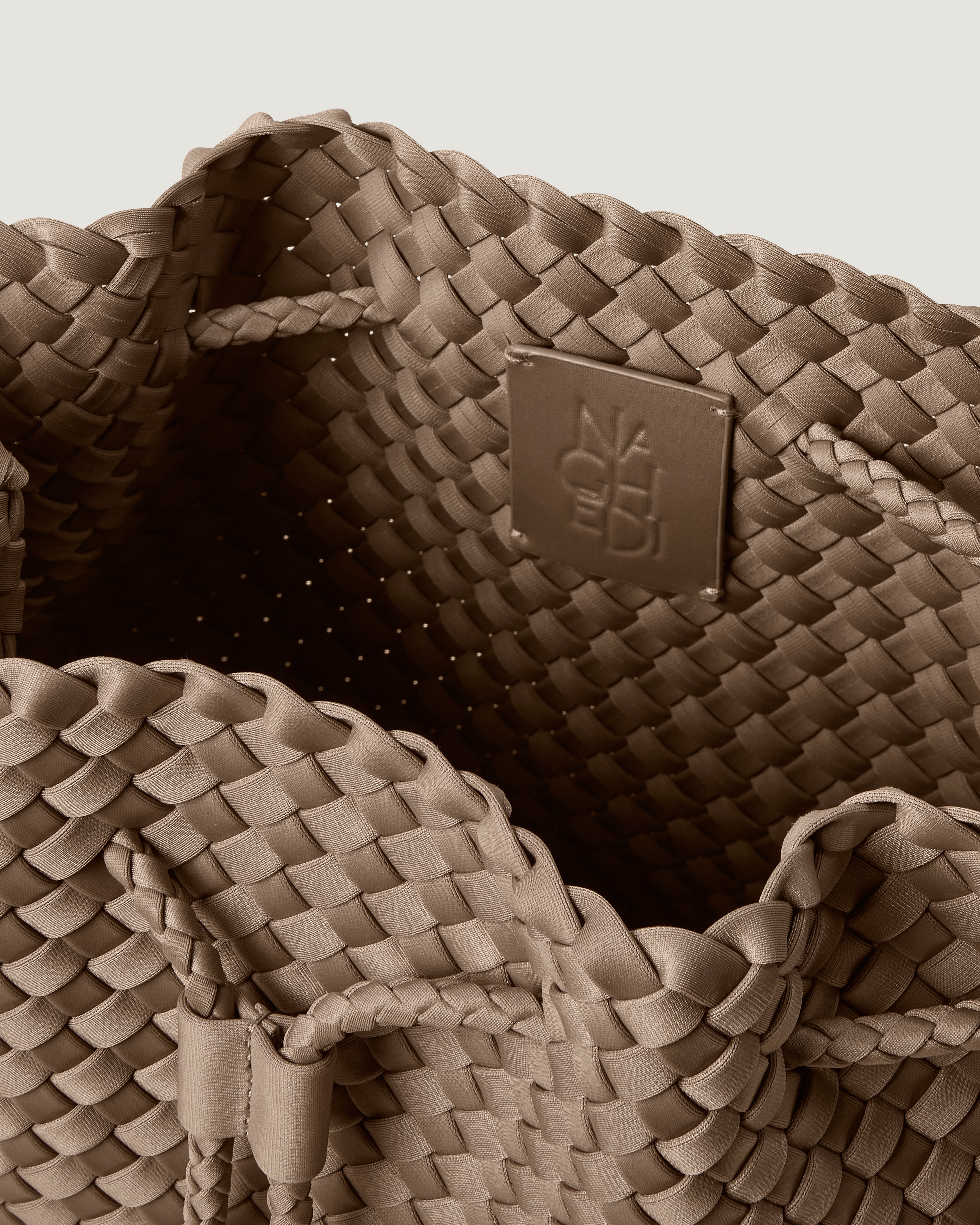 Interior close-up of Mercer Bucket in Cashmere showing its drawstring closure, and unlined interior.