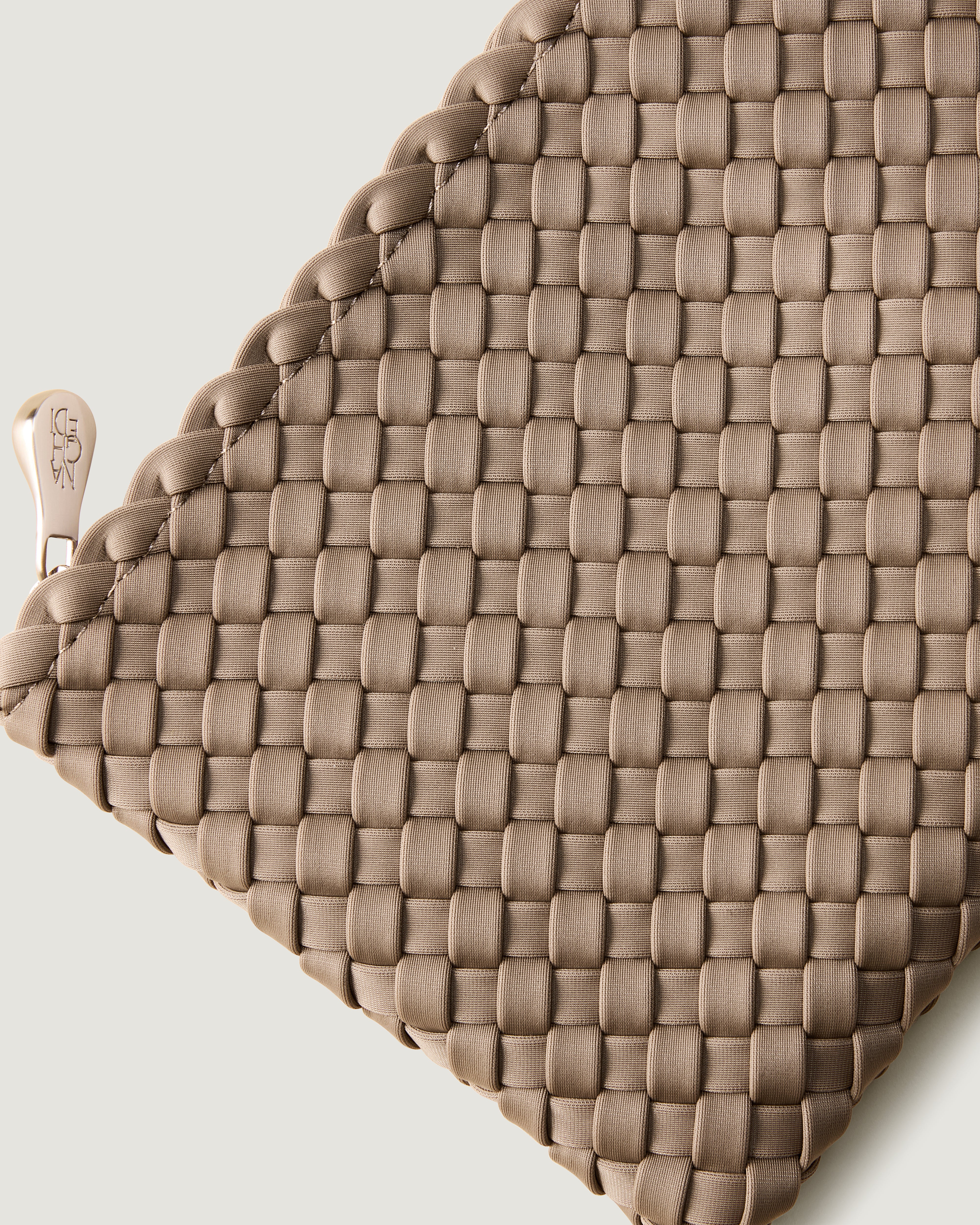 Close-up of included matching woven zippered pouch.