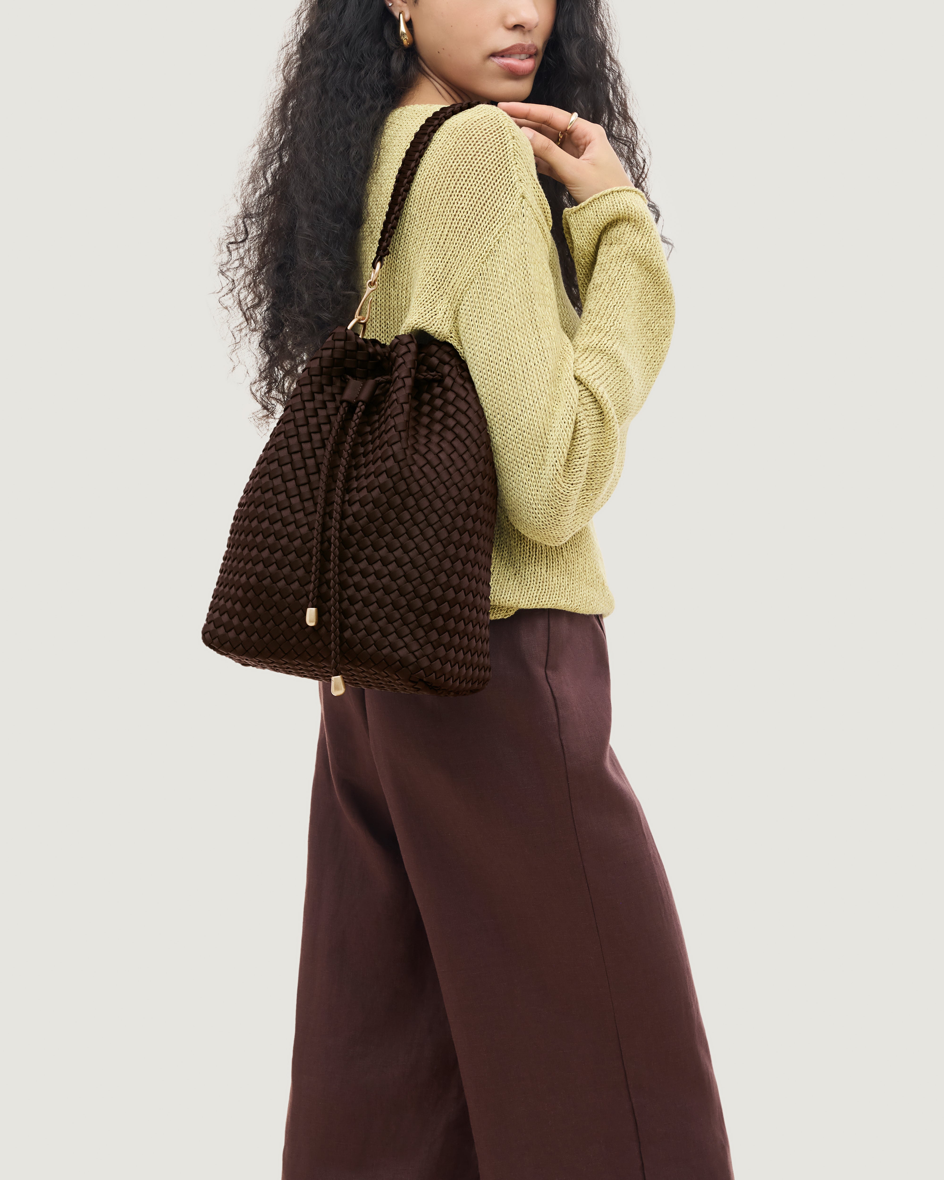 Mercer Bucket in Chocolate shown on model to illustrate scale and soft silhouette.