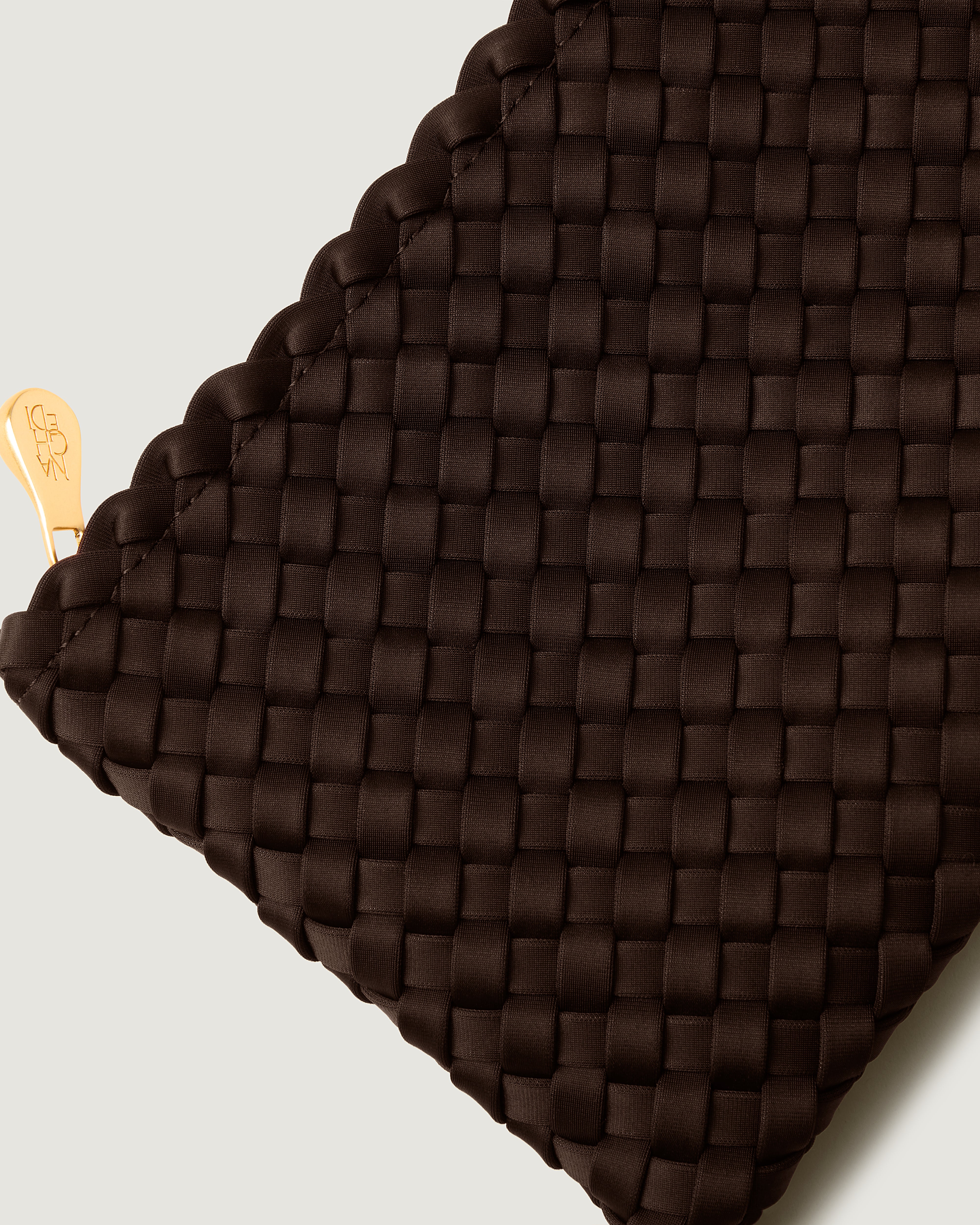 Close-up of included matching woven zippered pouch.