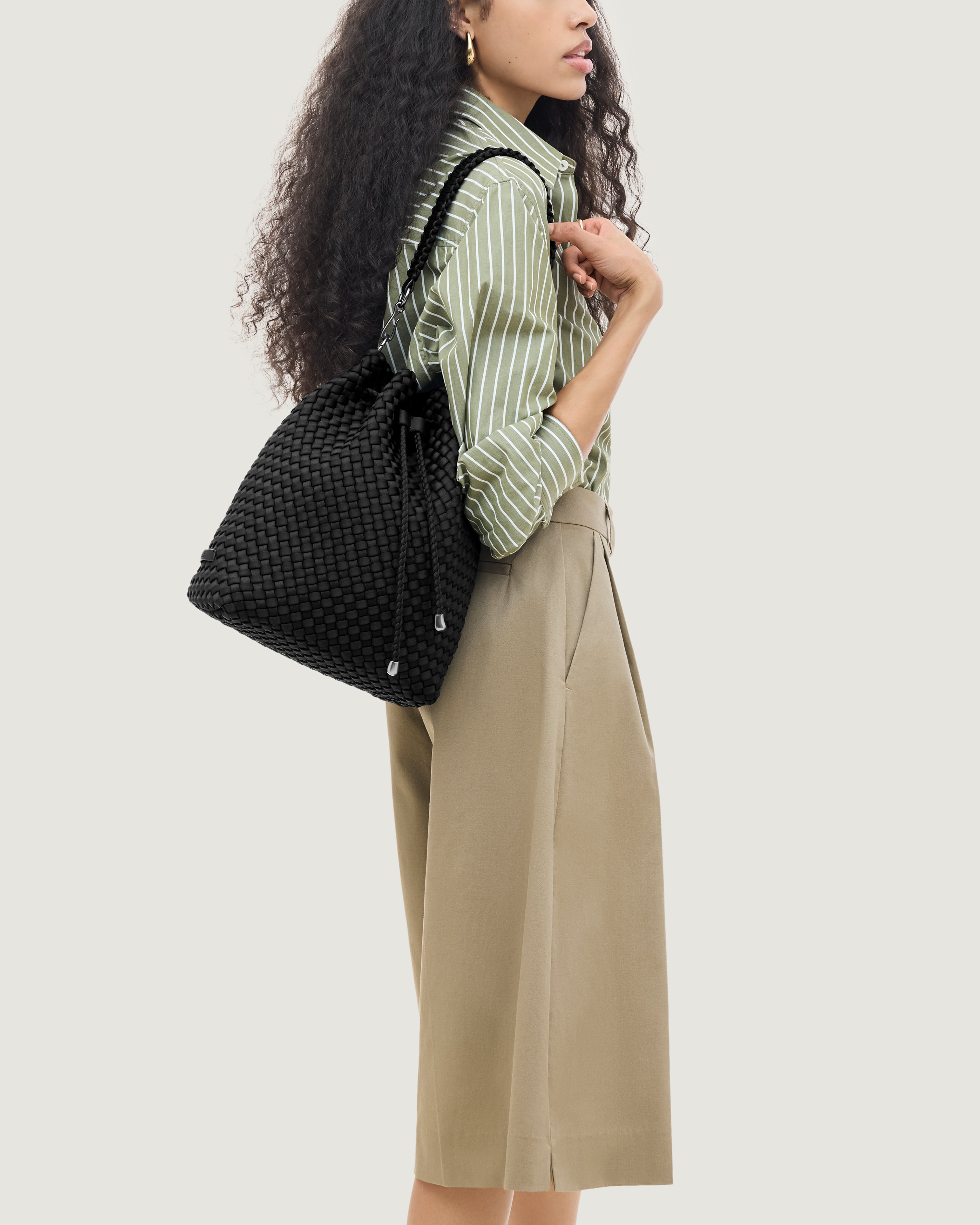 Mercer Bucket in Onyx shown on model to illustrate scale and soft silhouette.