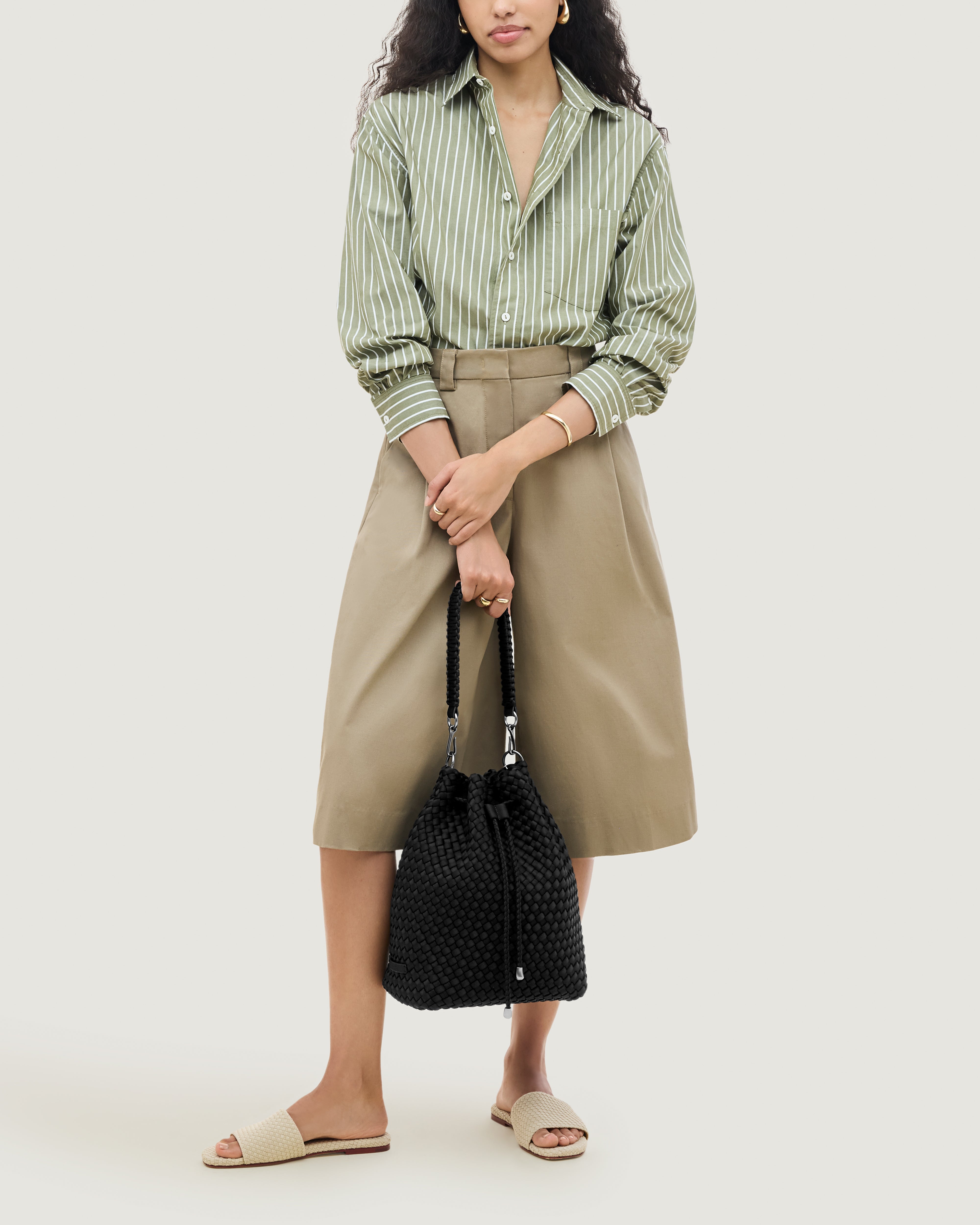 Mercer Bucket in Onyx shown on model to illustrate scale and soft silhouette.