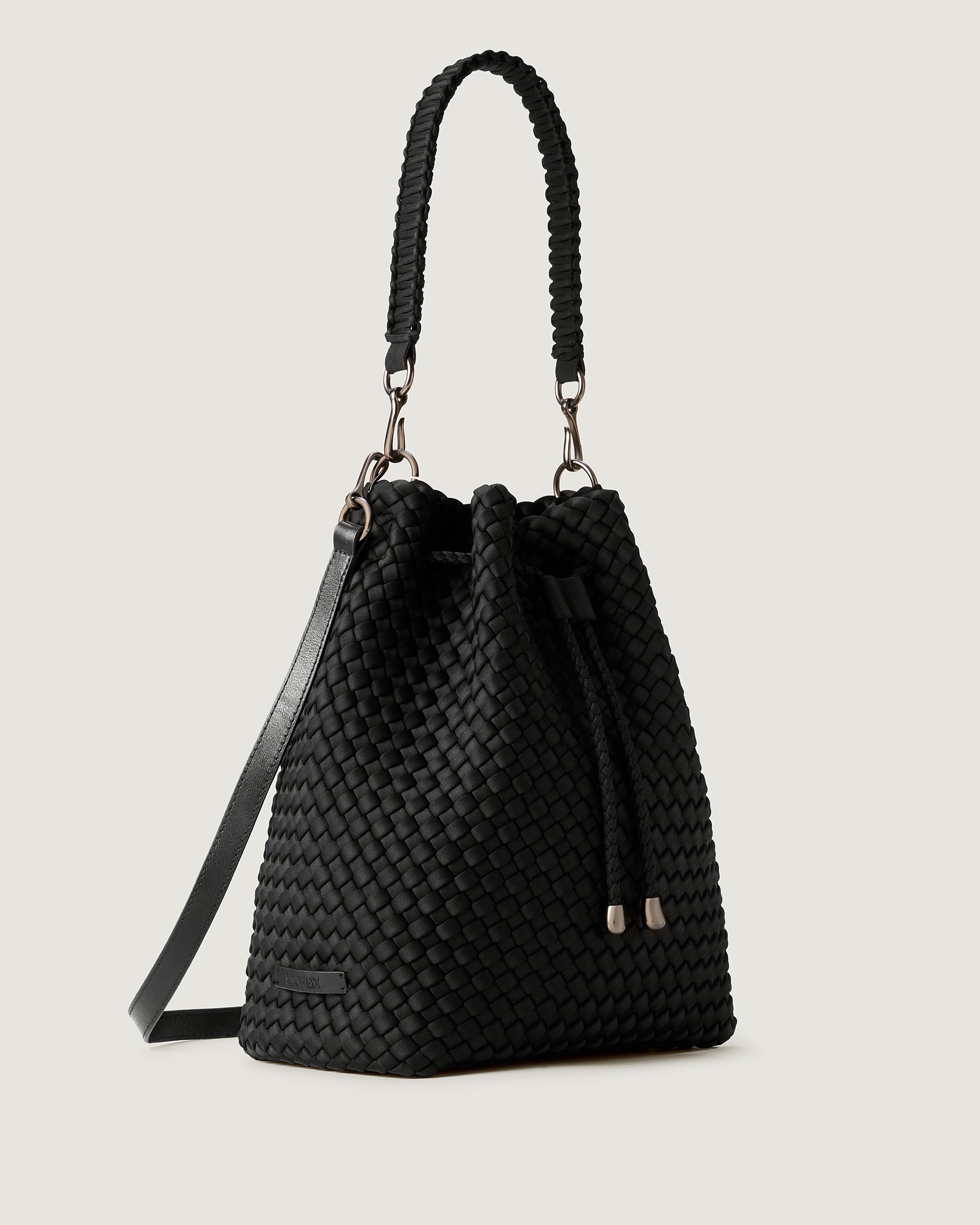 Mercer Bucket in Onyx shown from a side angle, highlighting its handwoven neoprene construction and drawstring closure.