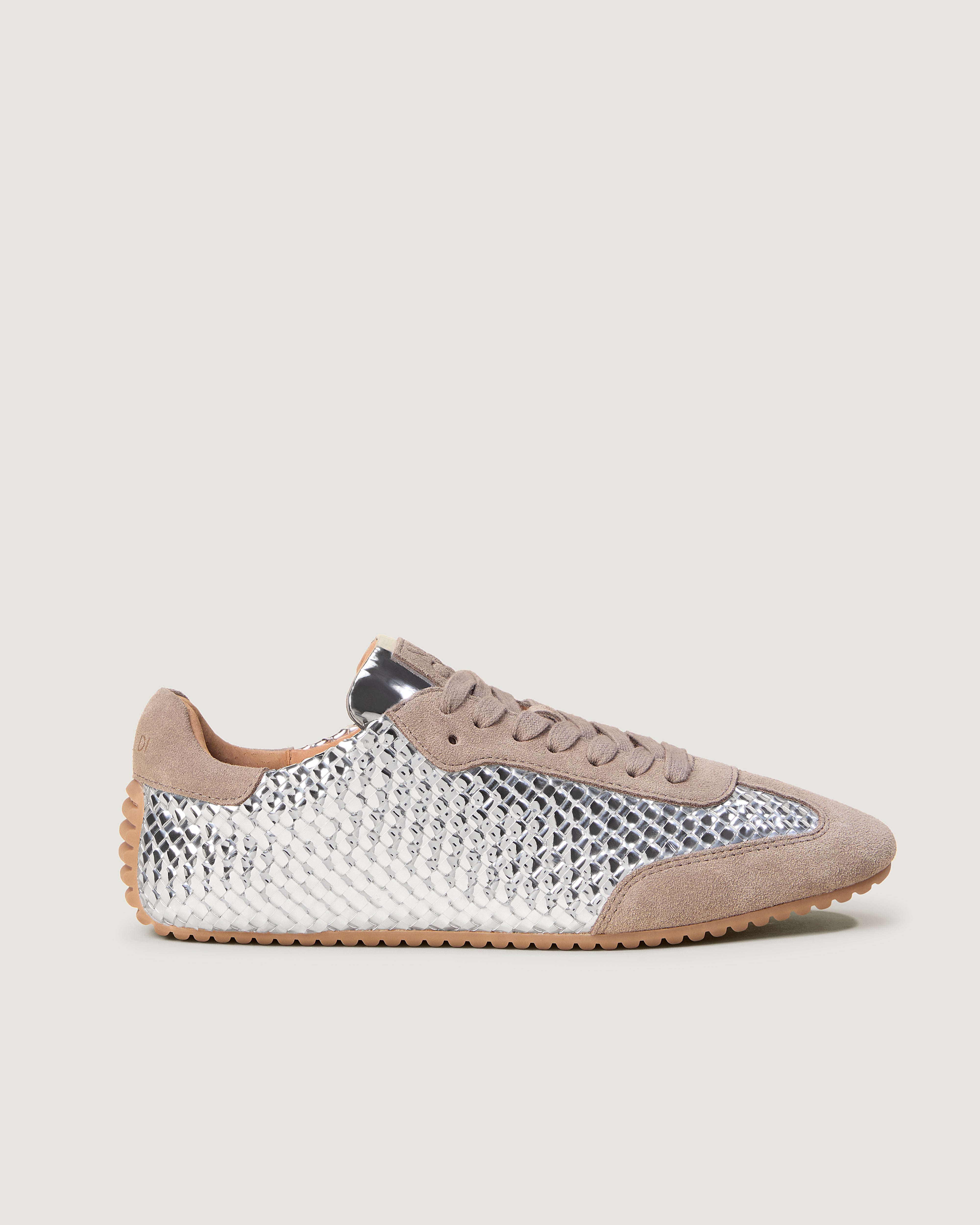 Side view of The Milan Sneaker in Silver, featuring a closed toe and almond silhouette.