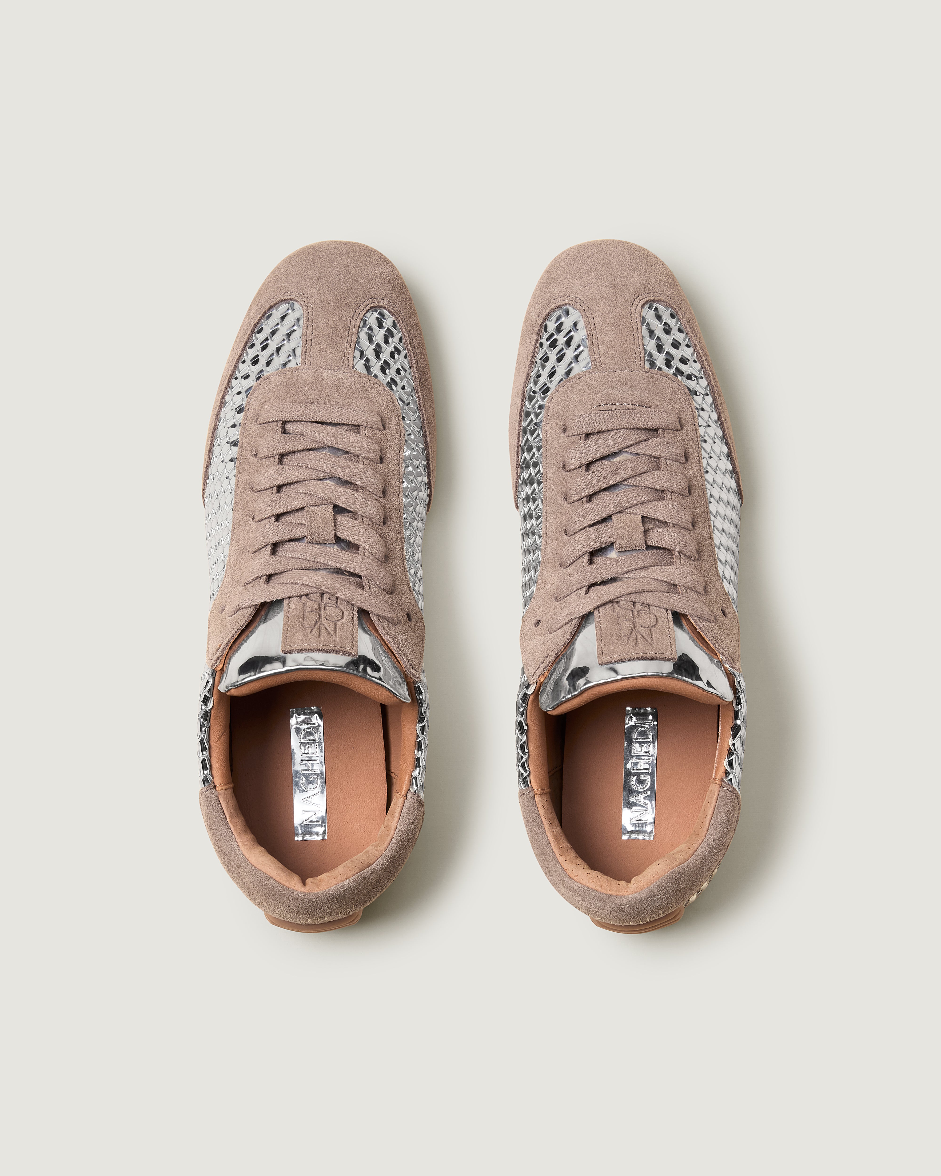 Top view of pair of The Milan Sneaker in Silver showing the natural tanned leather insole.