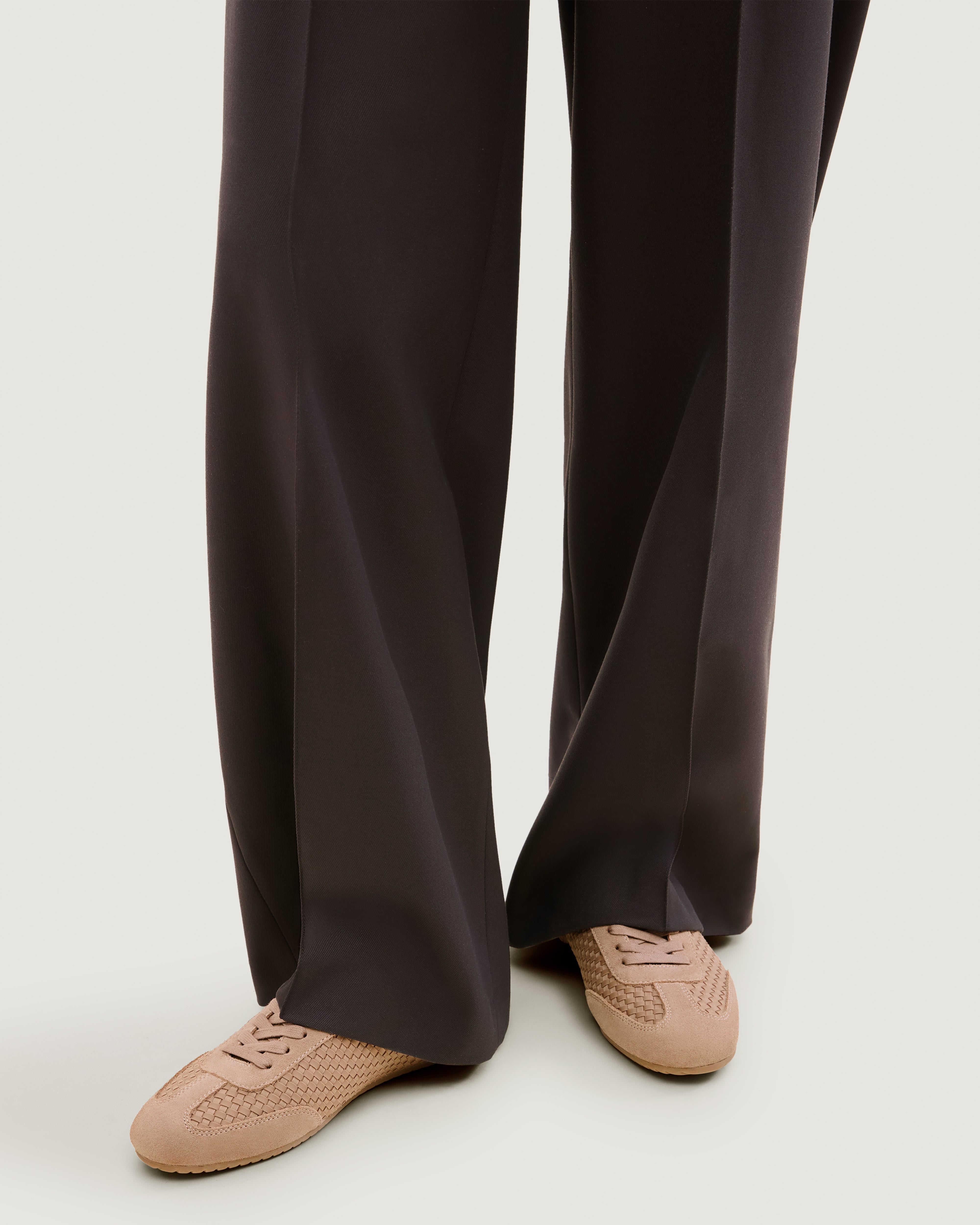 The Milan Sneaker in Seychelles shown on model.