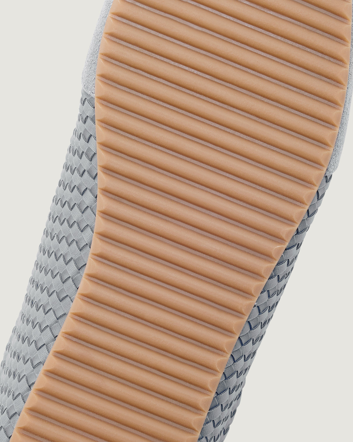 Shoe sole of the Milan Sneaker in Slate Blue showing rubber composition and ridged texture.