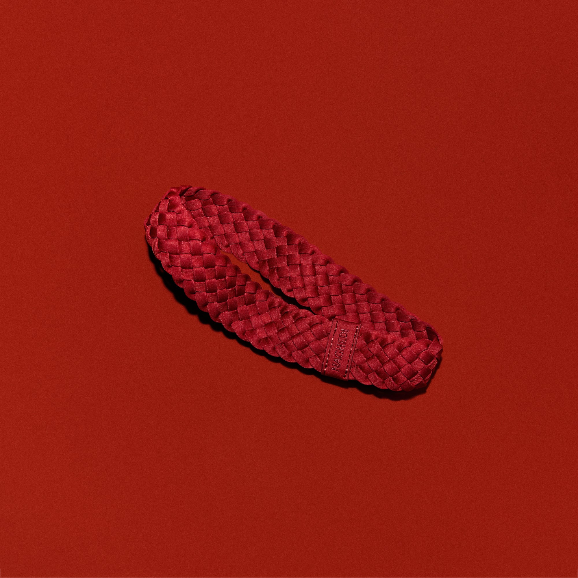 Rivage Headband in Rosso, a rich red tone.