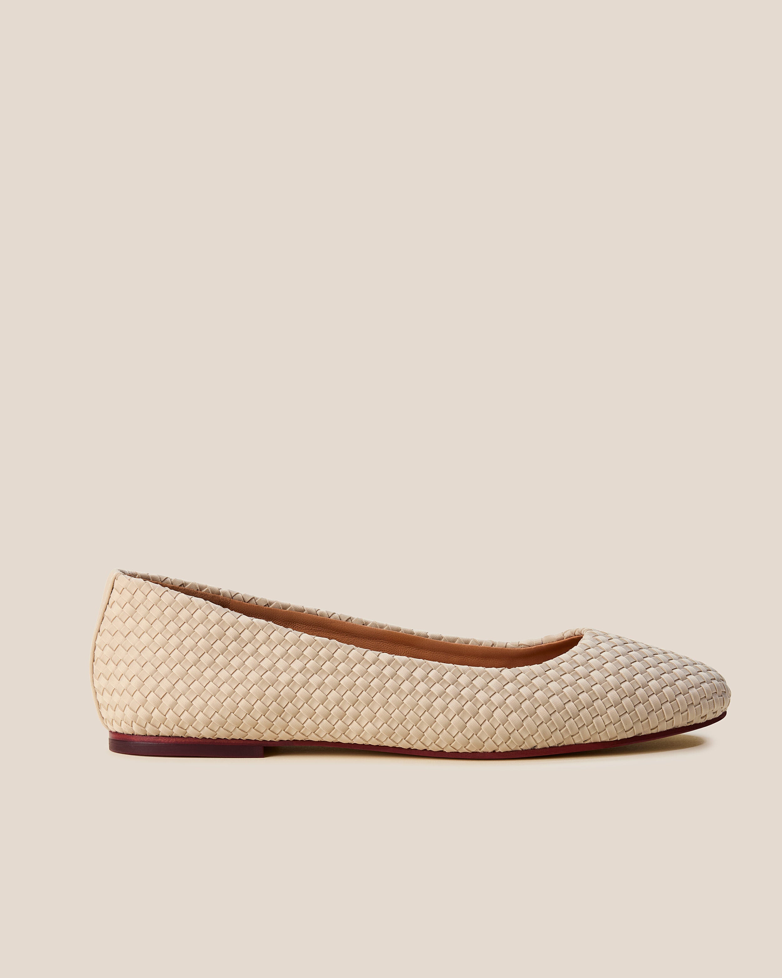 Side view of The Nomad Ballet Flat in Ecru, a cream tone, featuring a closed toe and square silhouette.