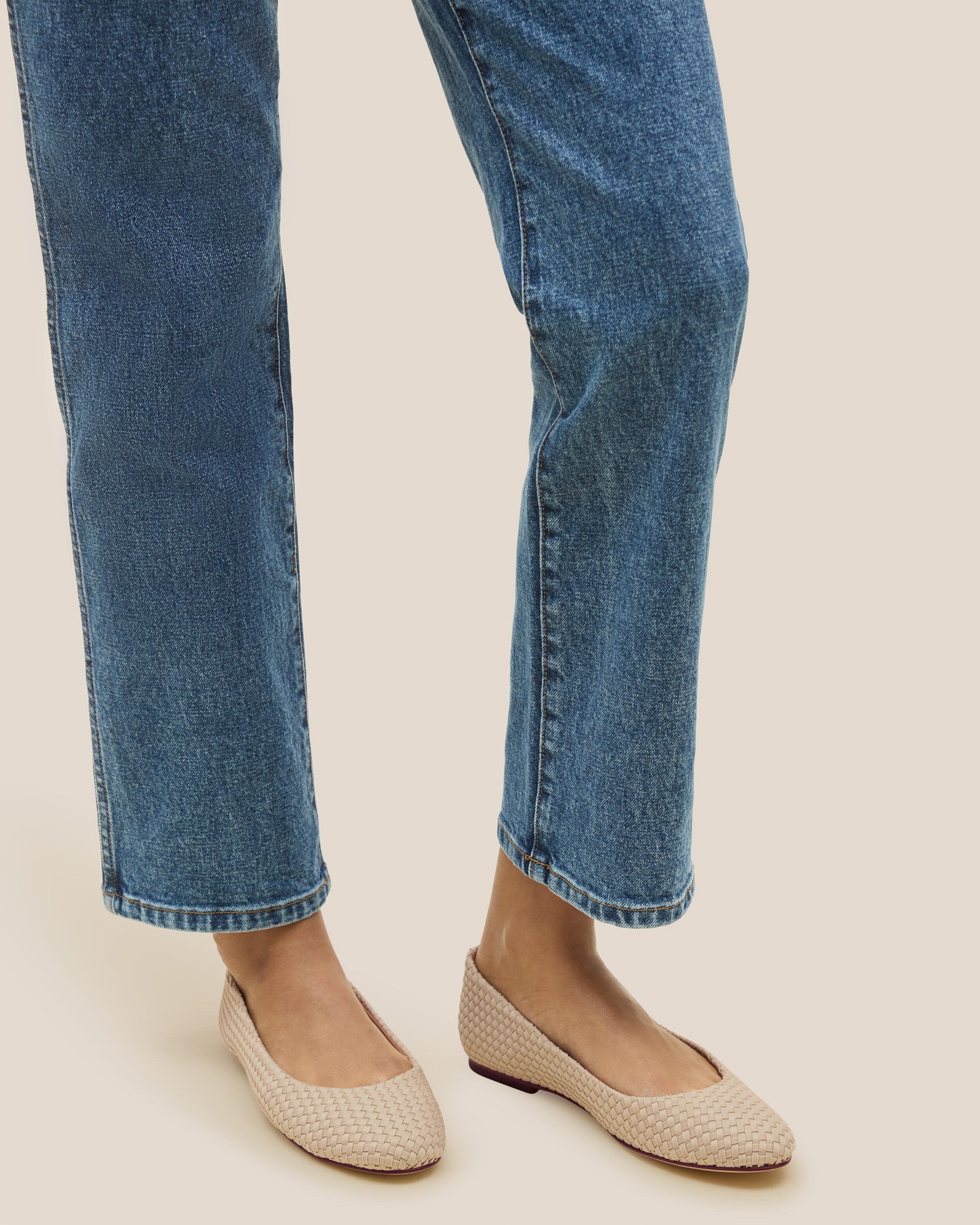 The Nomad Ballet Flat in Ecru shown on model.