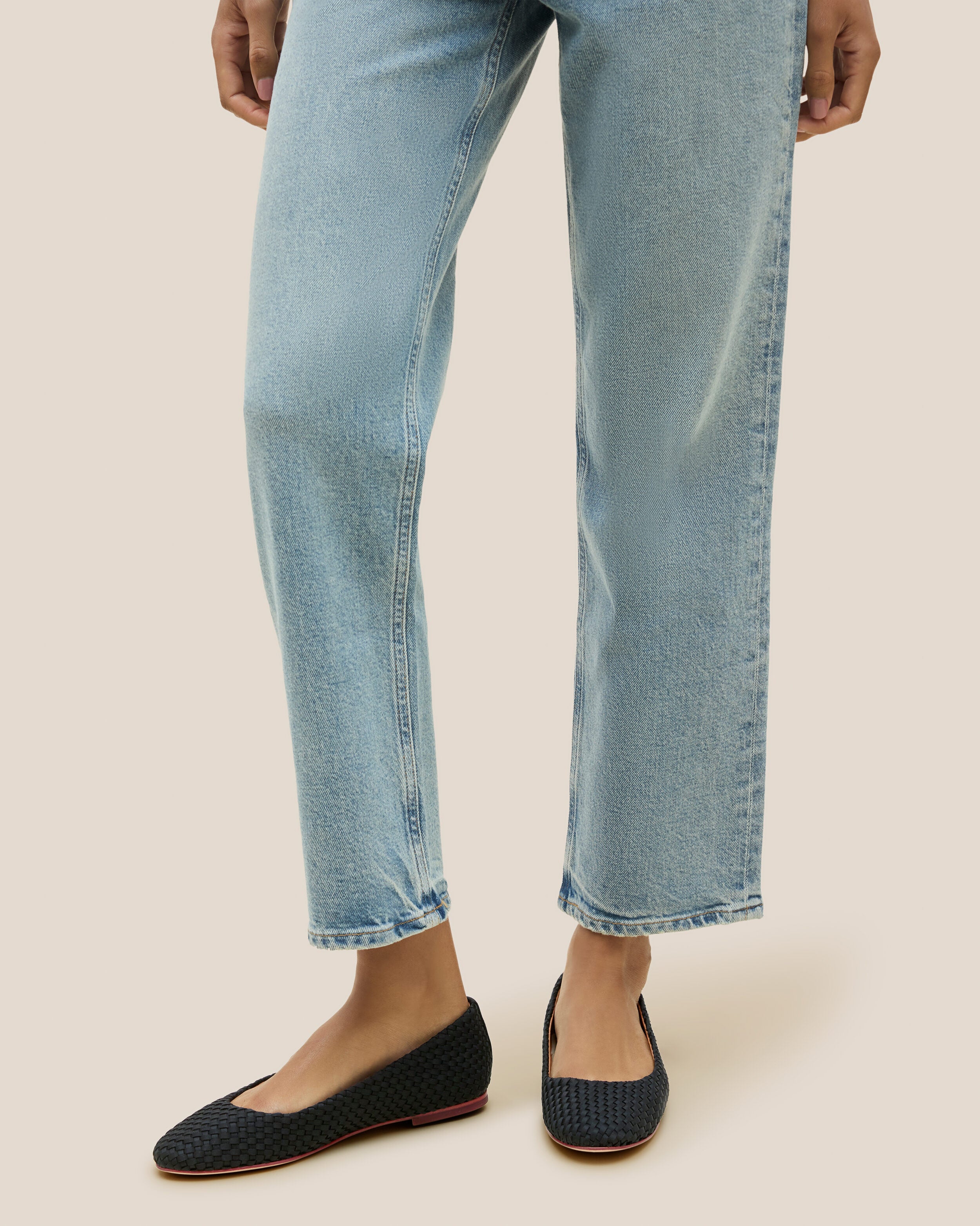 The Nomad Ballet Flat in Onyx shown on model.