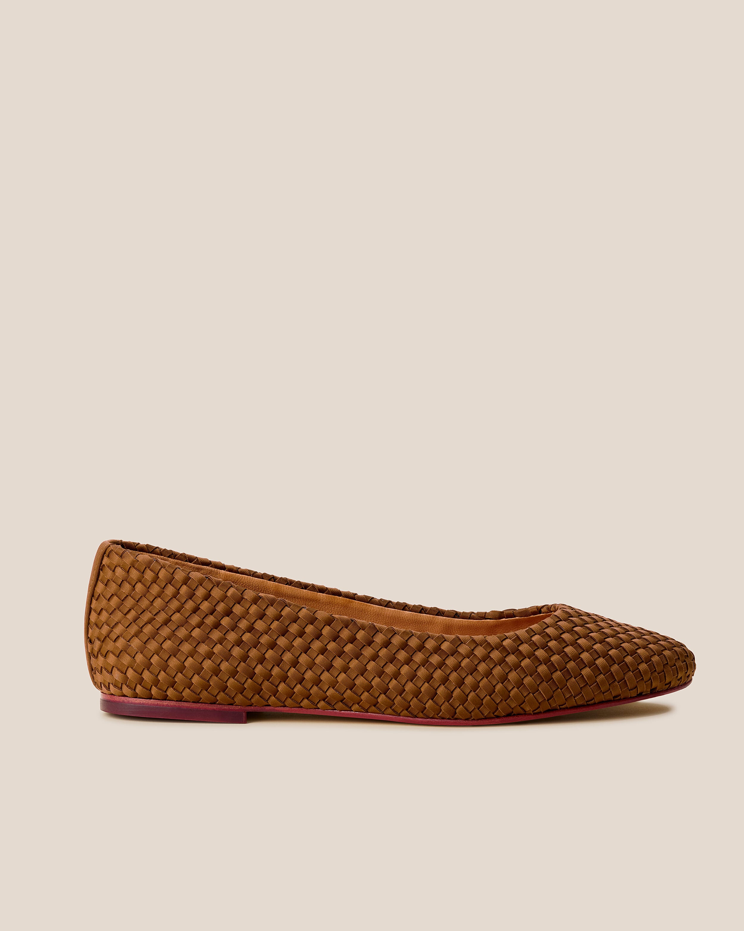 Side view of The Nomad Ballet Flat in Teak, a saddle brown tone, featuring a closed toe and square silhouette.