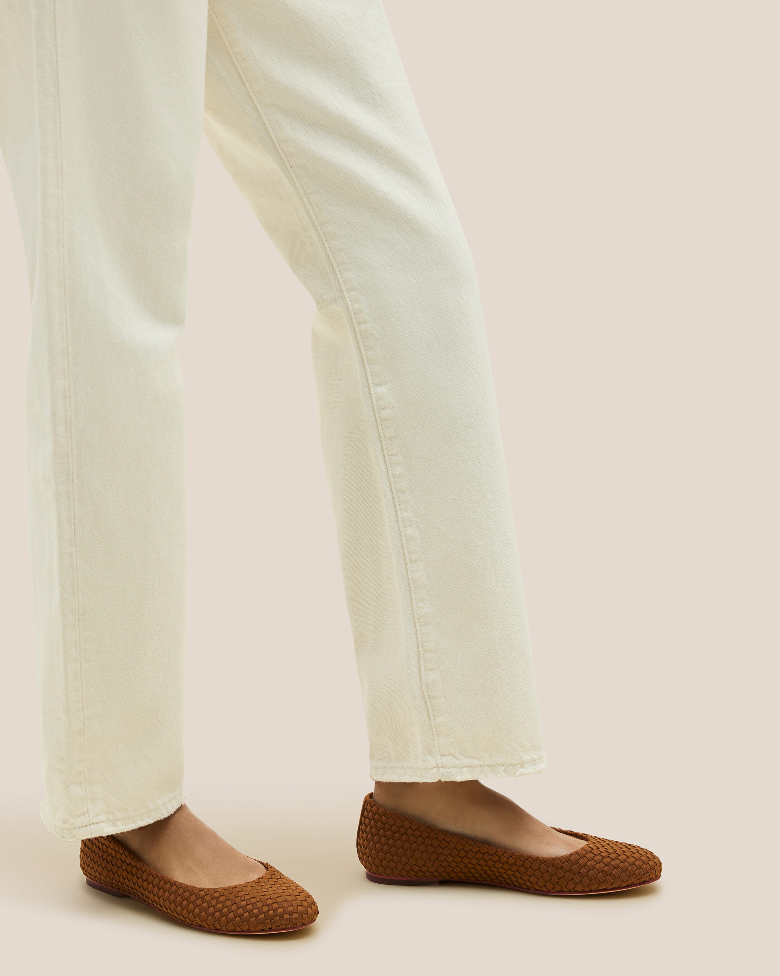 The Nomad Ballet Flat in Teak shown on model.