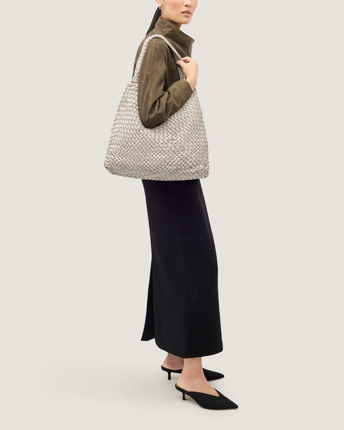 Nomad Large Hobo in Linen shown on model to illustrate scale and soft silhouette.