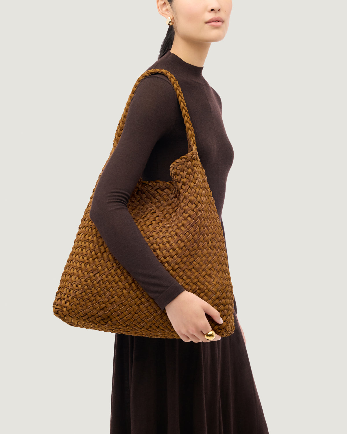 Nomad Large Hobo in Teak shown on model to illustrate scale and soft silhouette.