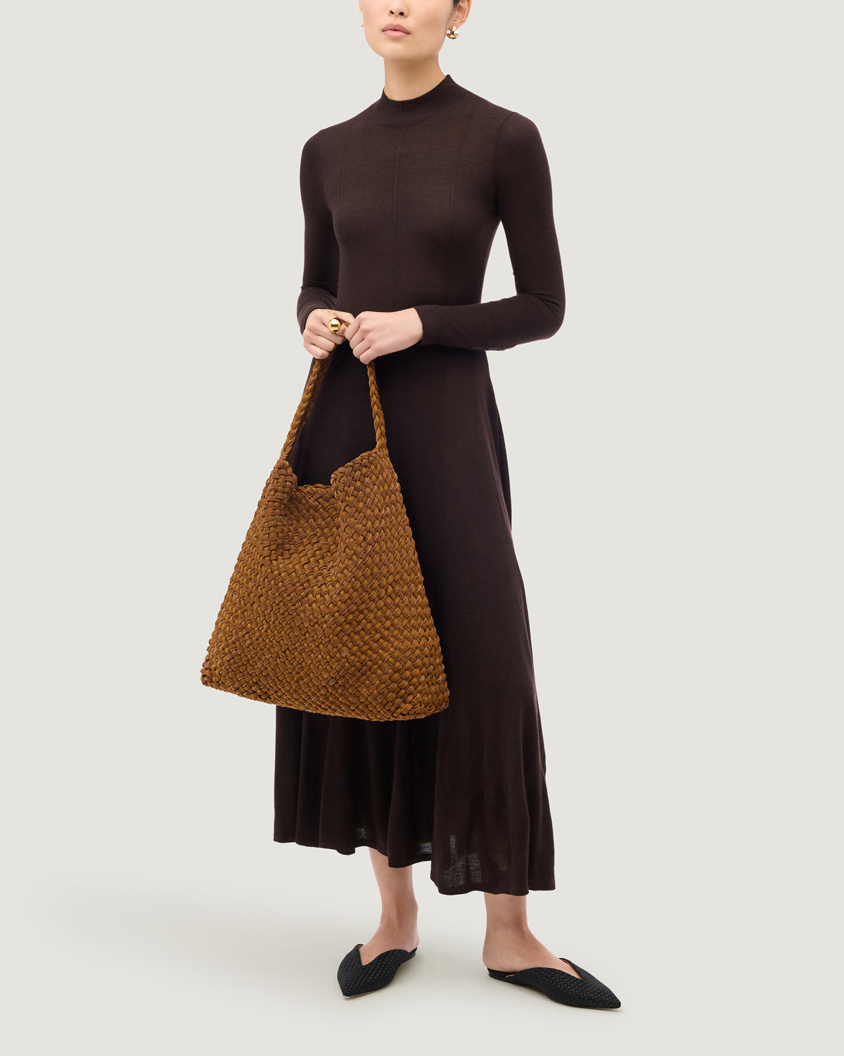Nomad Large Hobo in Teak shown on model to illustrate scale and soft silhouette.