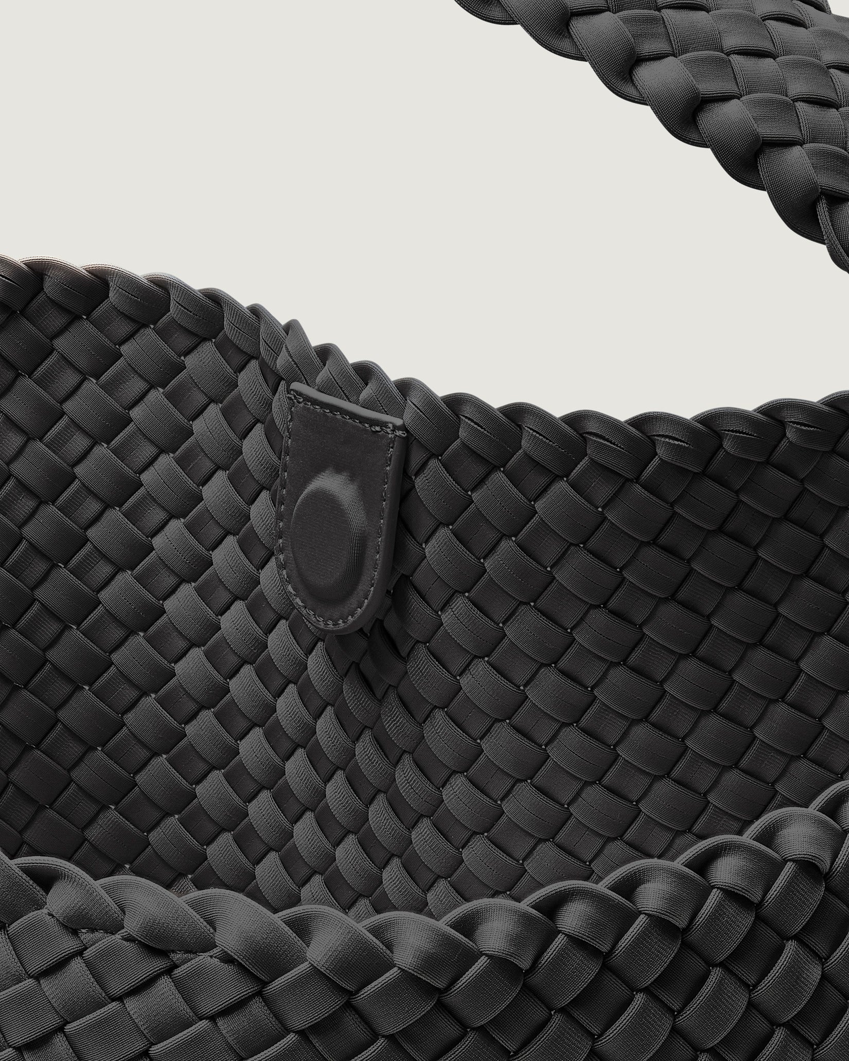 Interior close-up of Nomad Large Hobo Bag in Ash showing its open top with magnetic snap closure, and unlined interior.