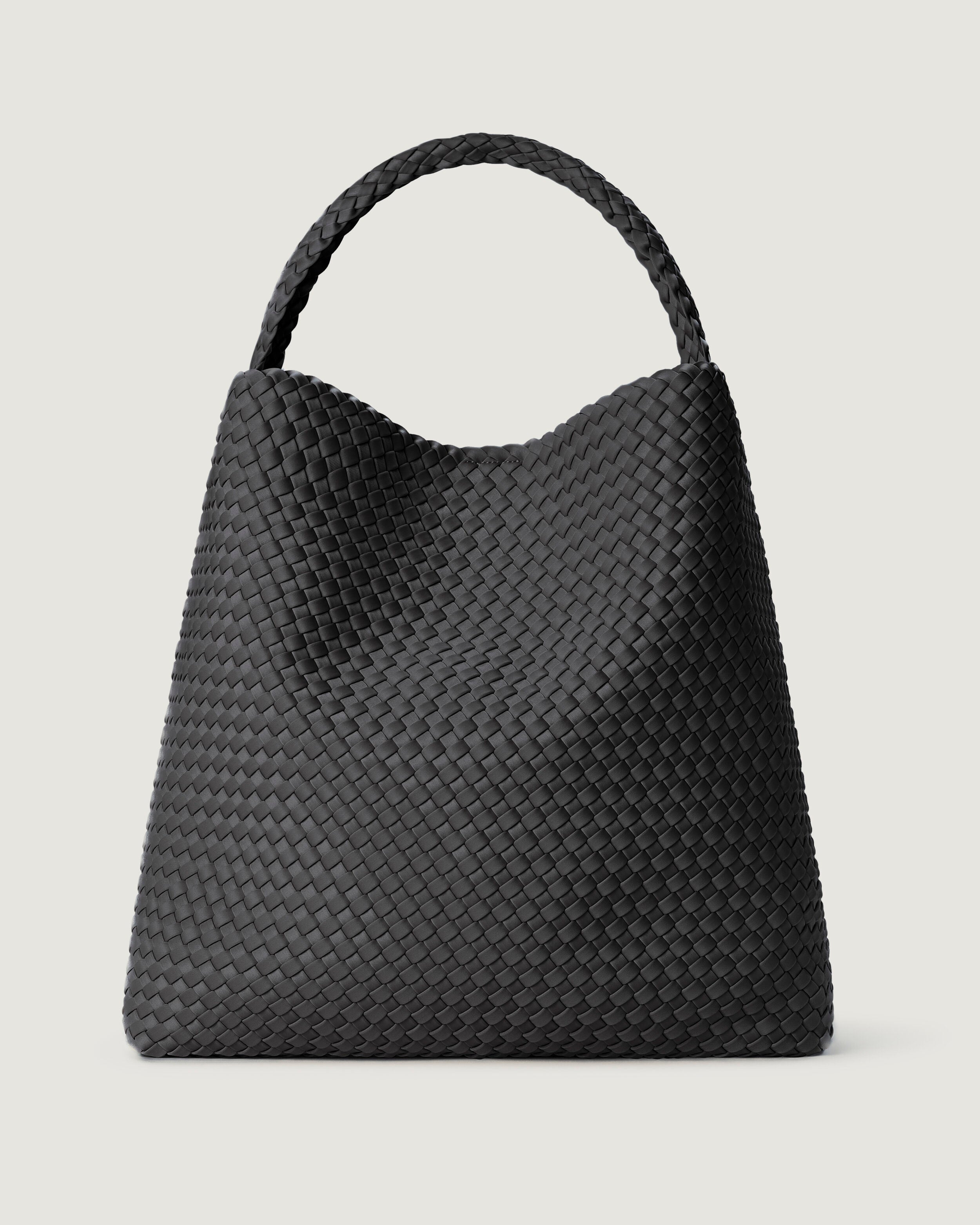 Nomad Hobo in Ash, a slate gray  tone, in handwoven neoprene, featuring an open top with magnetic snap closure, and handwoven shoulder strap lays comfortably flat.