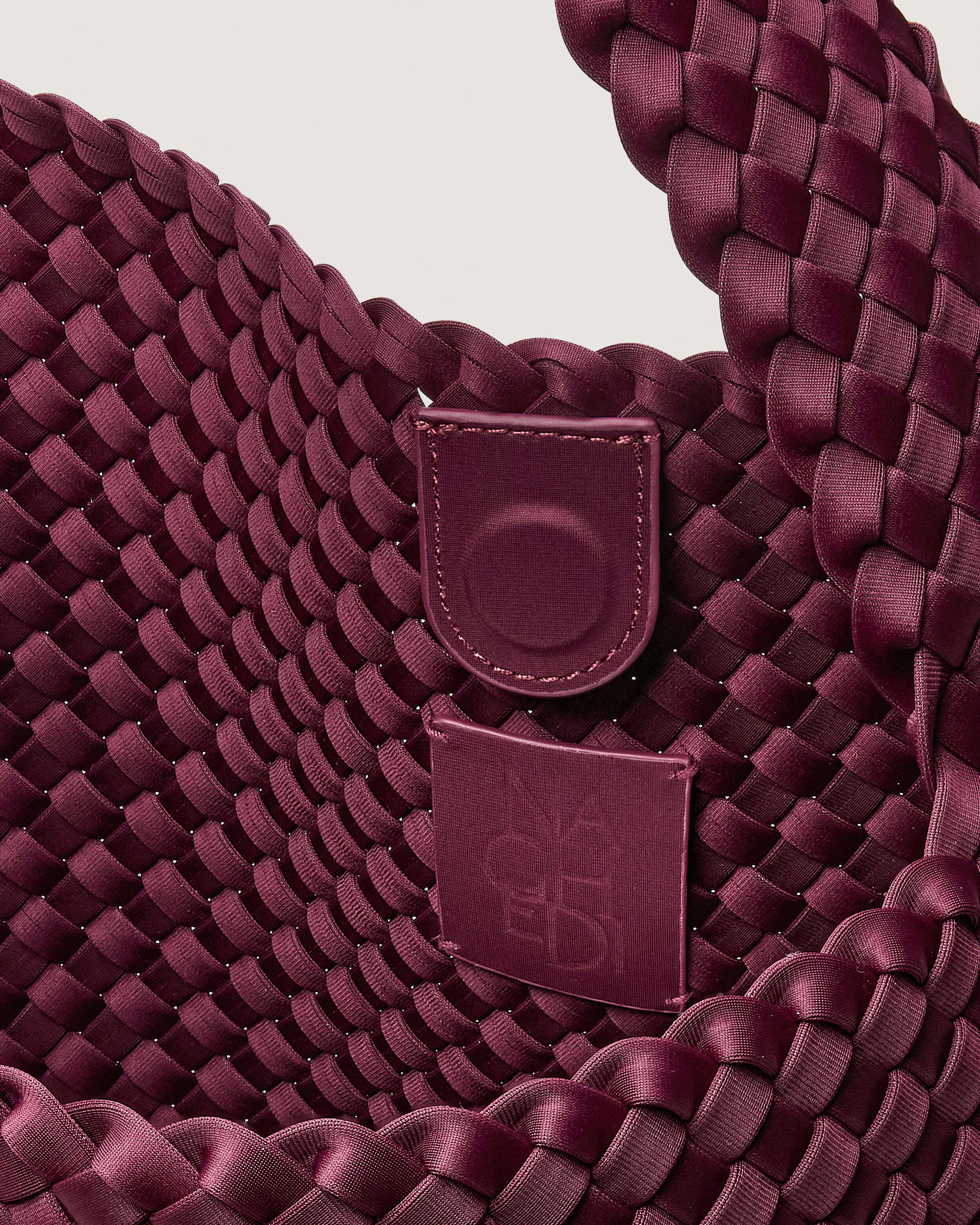 Interior close-up of Nomad Hobo in Bordeaux showing its open top with magnetic snap closure, and unlined interior.