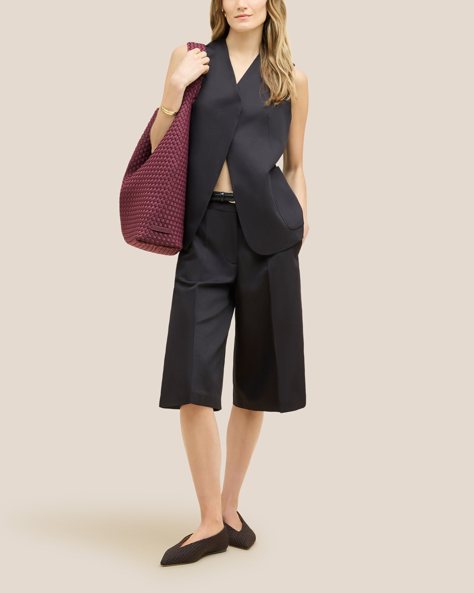 Nomad Large Hobo Bag in Bordeaux shown on model to illustrate scale and soft silhouette.