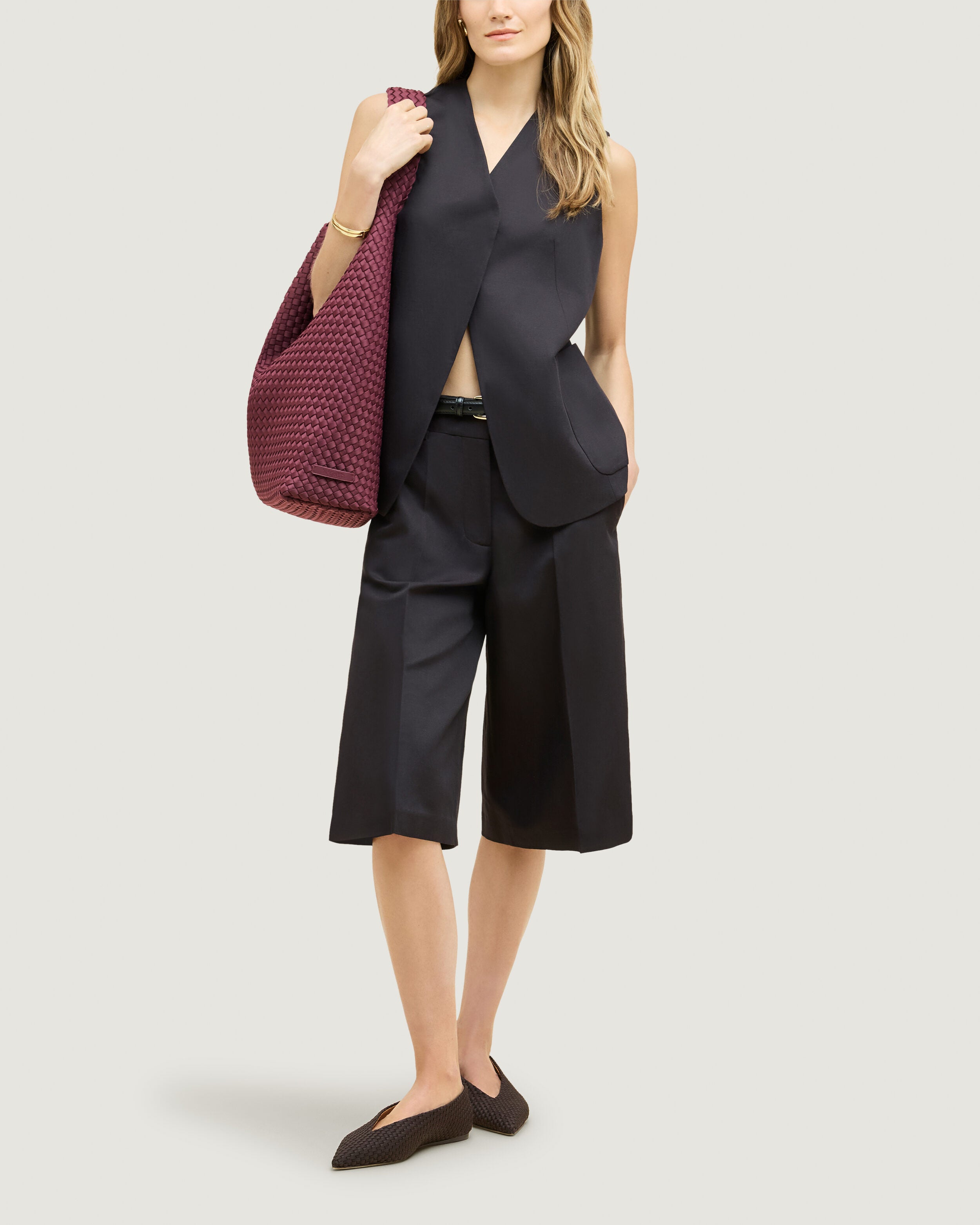 Nomad Hobo in Bordeaux shown on model to illustrate scale and soft silhouette.