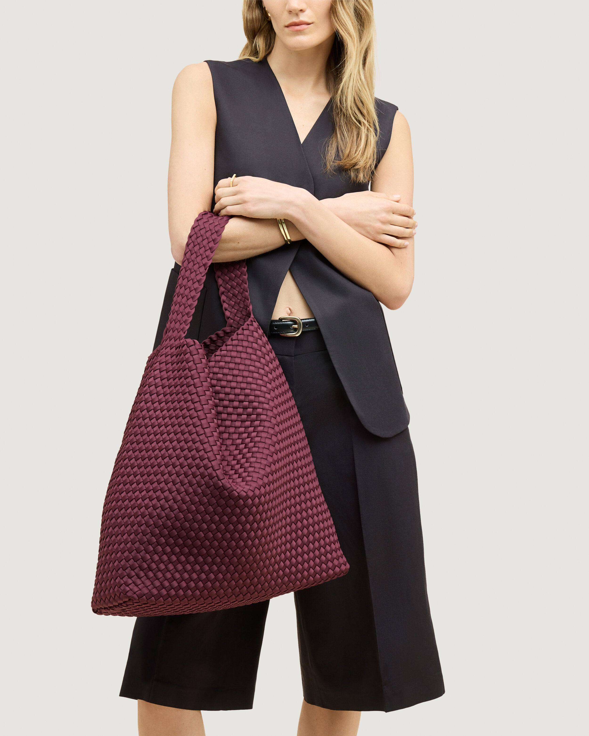 Nomad Hobo in Bordeaux shown on model to illustrate scale and soft silhouette.