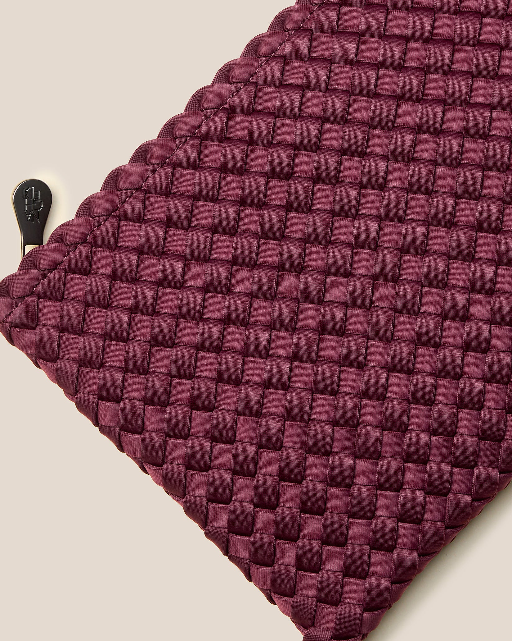 Close-up of included matching woven zippered pouch.