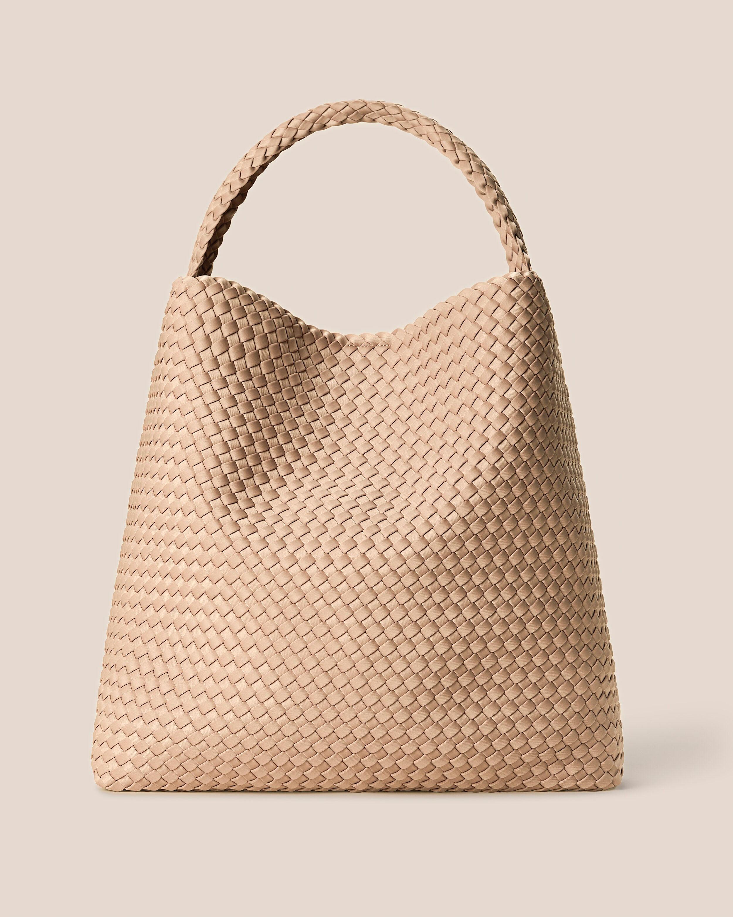 Nomad Hobo in Camel, a camel brown tone, in handwoven neoprene, featuring an open top with magnetic snap closure, and handwoven shoulder strap lays comfortably flat.