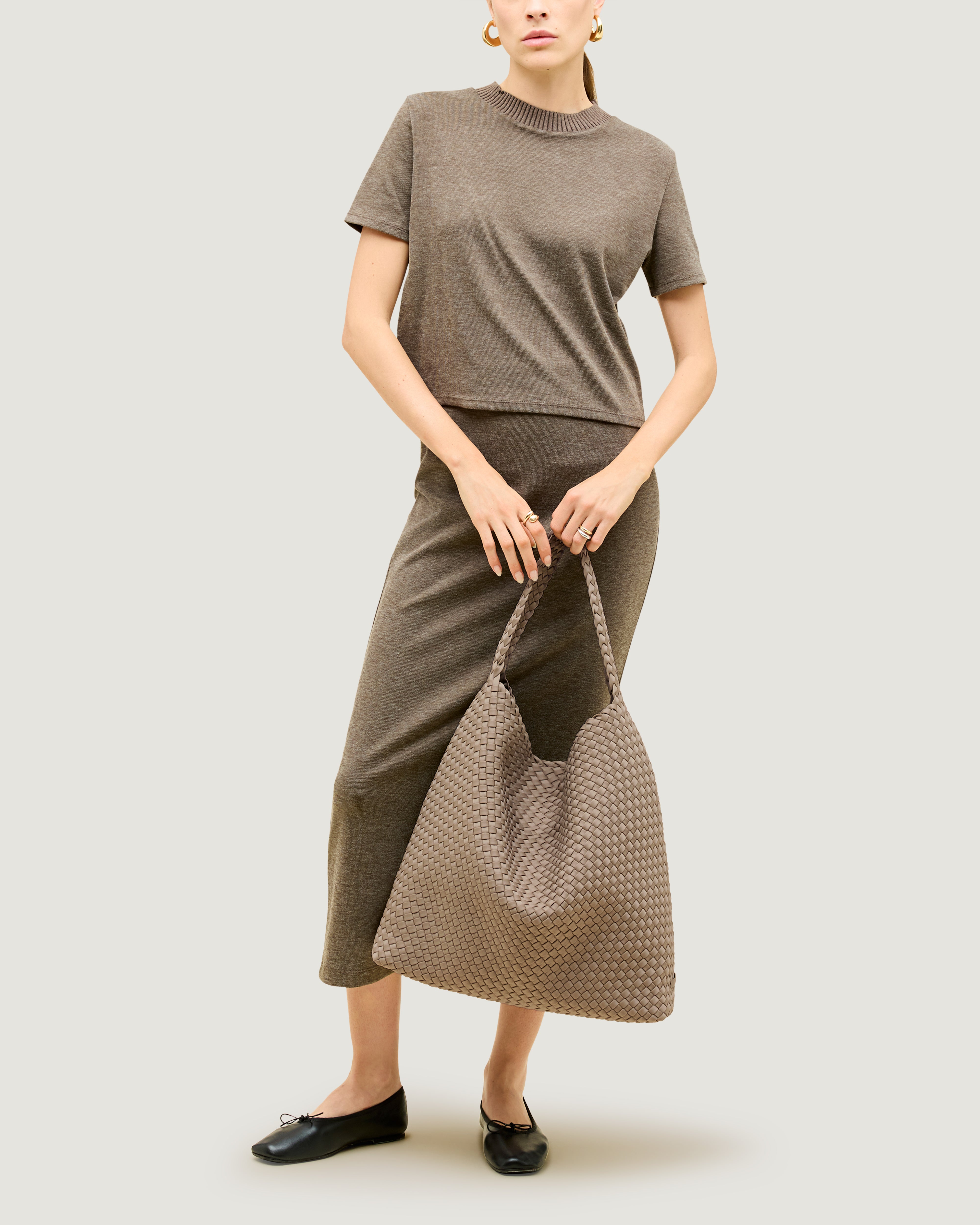 Nomad Hobo in Cashmere shown on model to illustrate scale and soft silhouette.