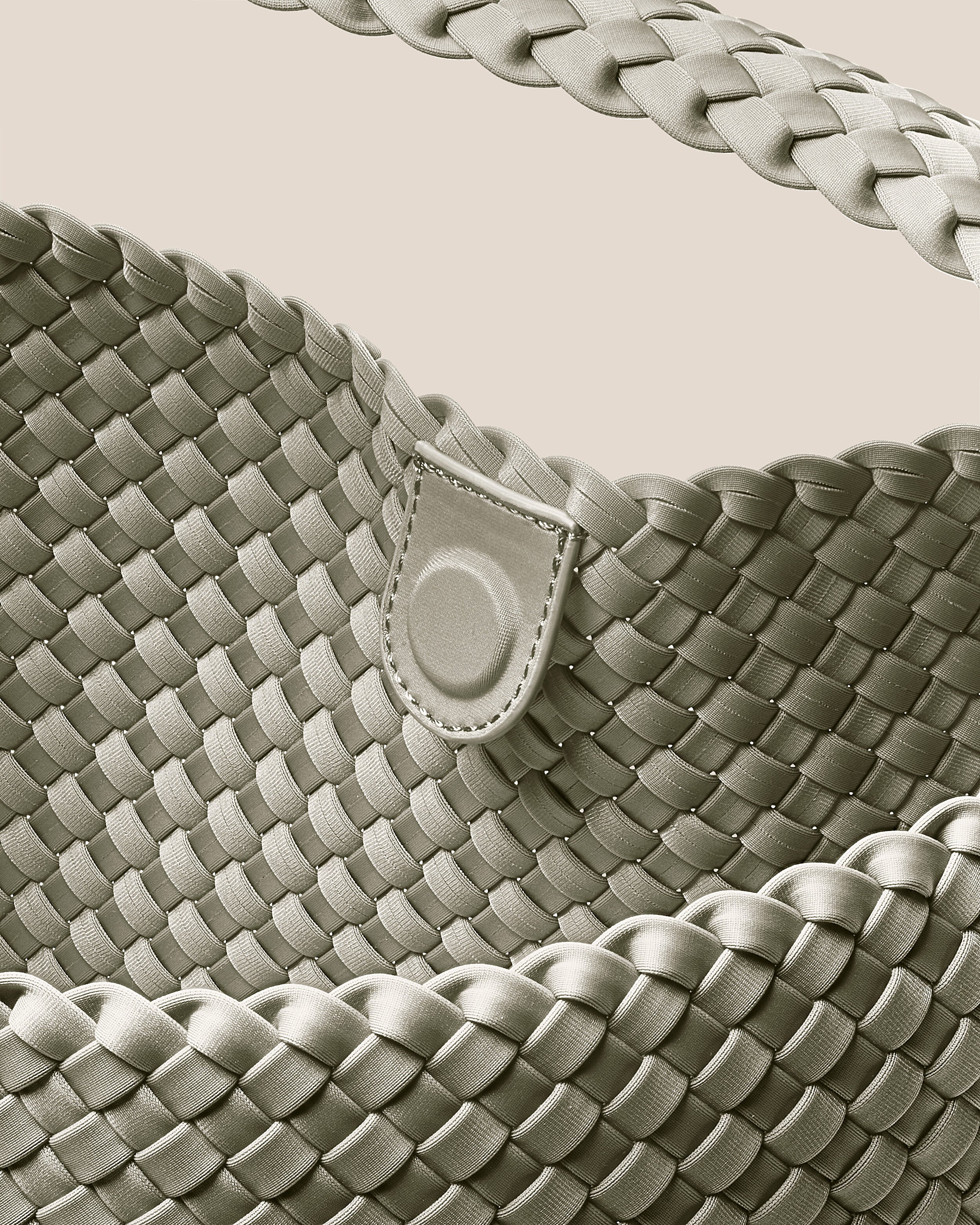 Interior close-up of Nomad Hobo in Celadon showing its open top with magnetic snap closure, and unlined interior.