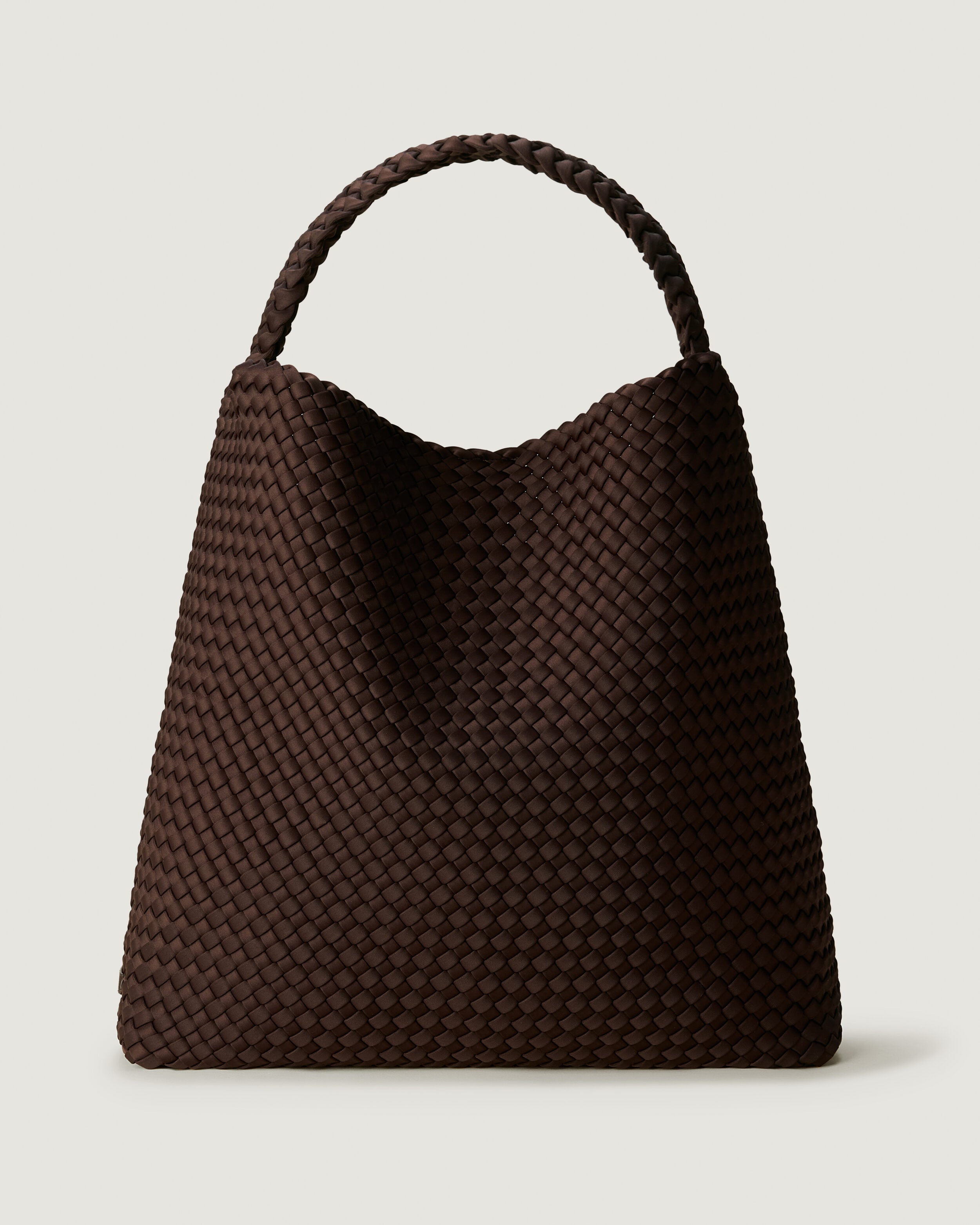Nomad Hobo in Chocolate, a dark chocolate brown tone, in handwoven neoprene, featuring an open top with magnetic snap closure, and handwoven shoulder strap lays comfortably flat.