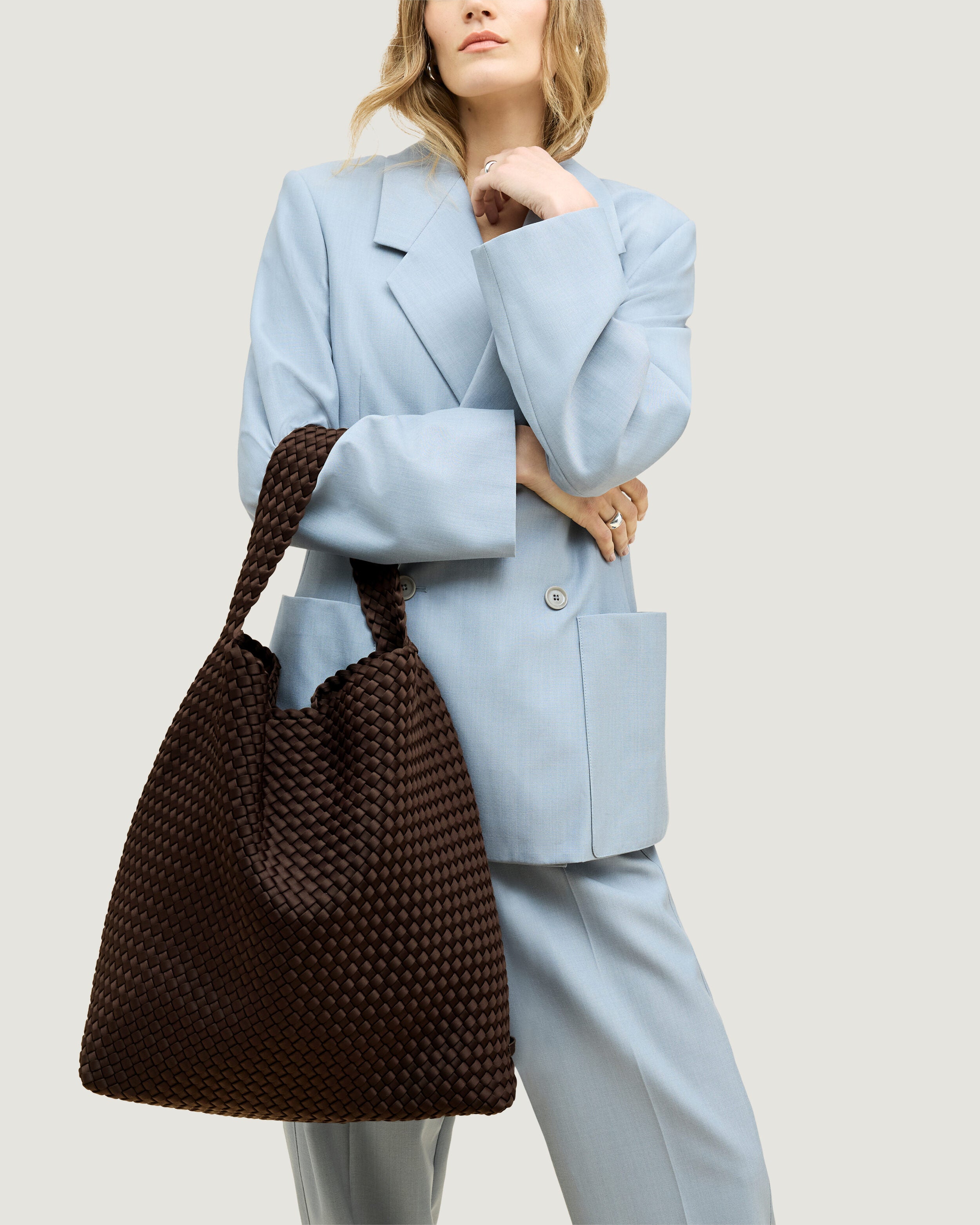 Nomad Hobo in Chocolate shown on model to illustrate scale and soft silhouette.