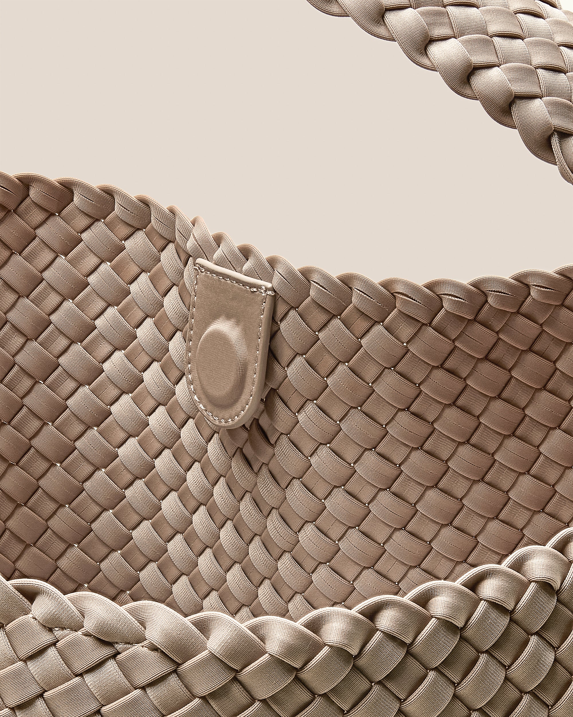 Interior close-up of Nomad Large Hobo Bag in Ecru showing its open top with magnetic snap closure, and unlined interior.