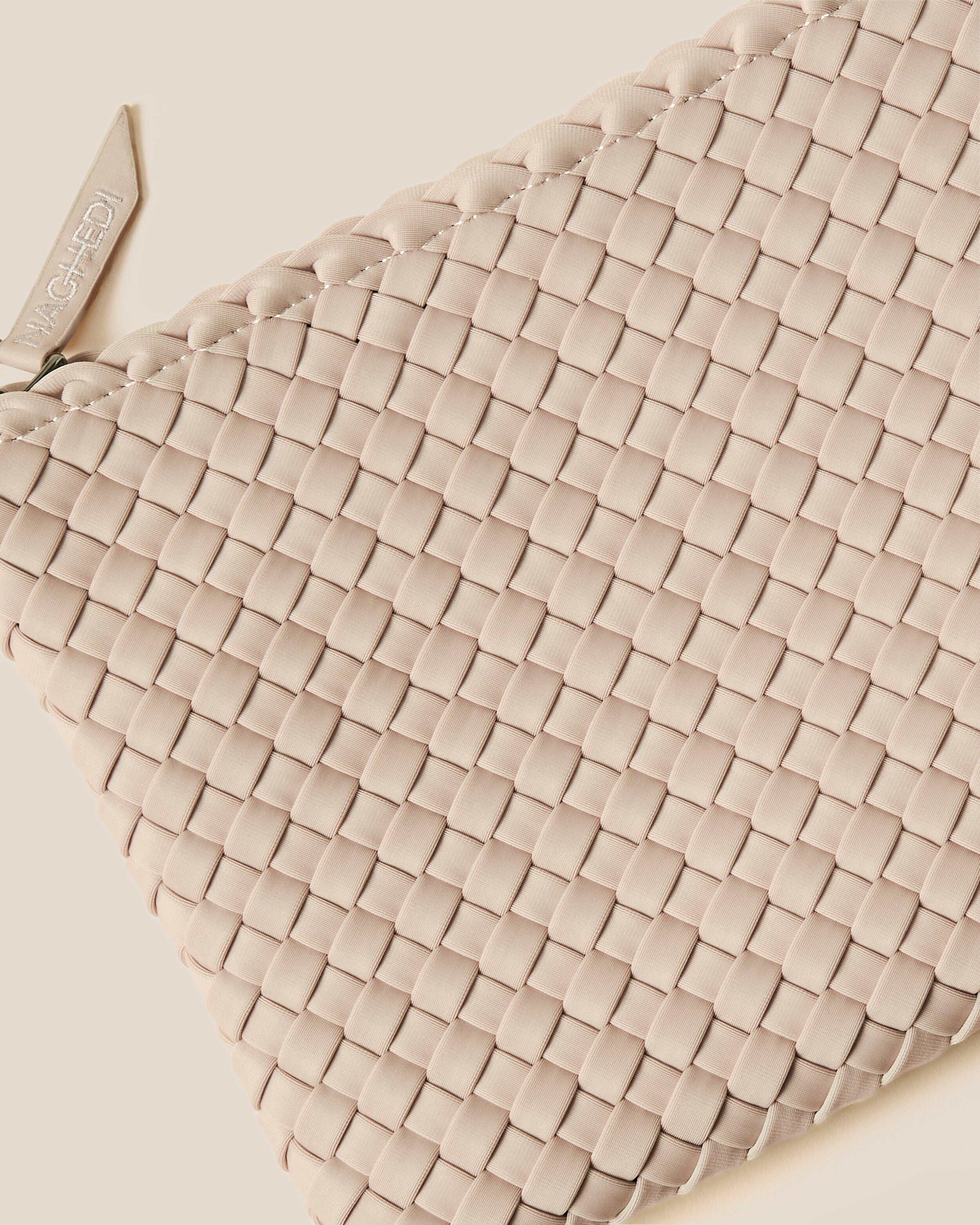 Close-up of included matching woven zippered pouch.