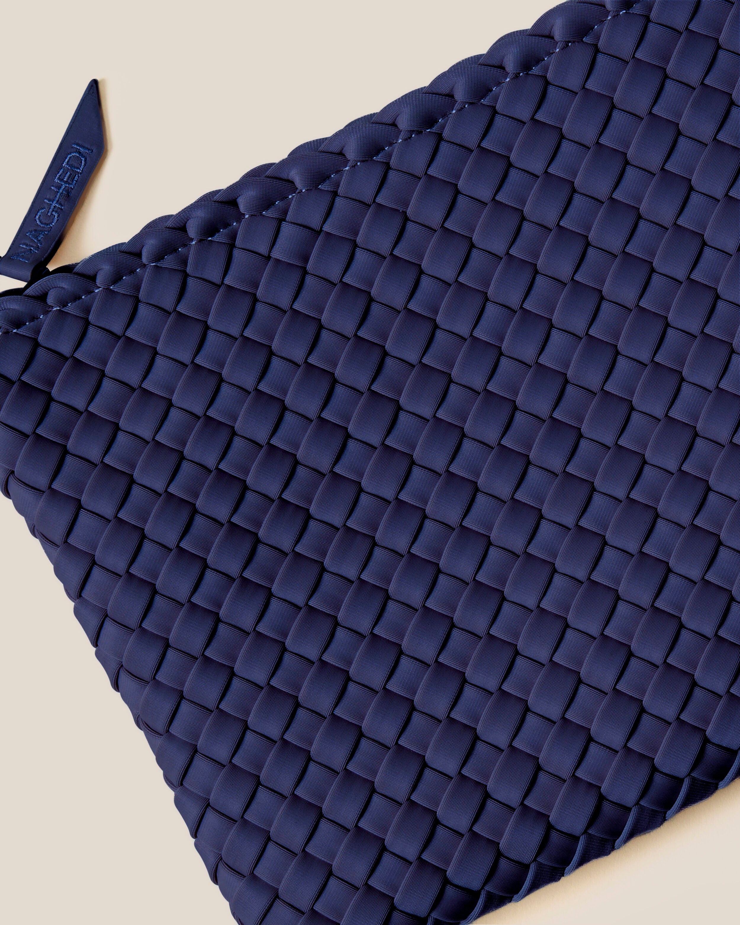 Close-up of included matching woven zippered pouch.